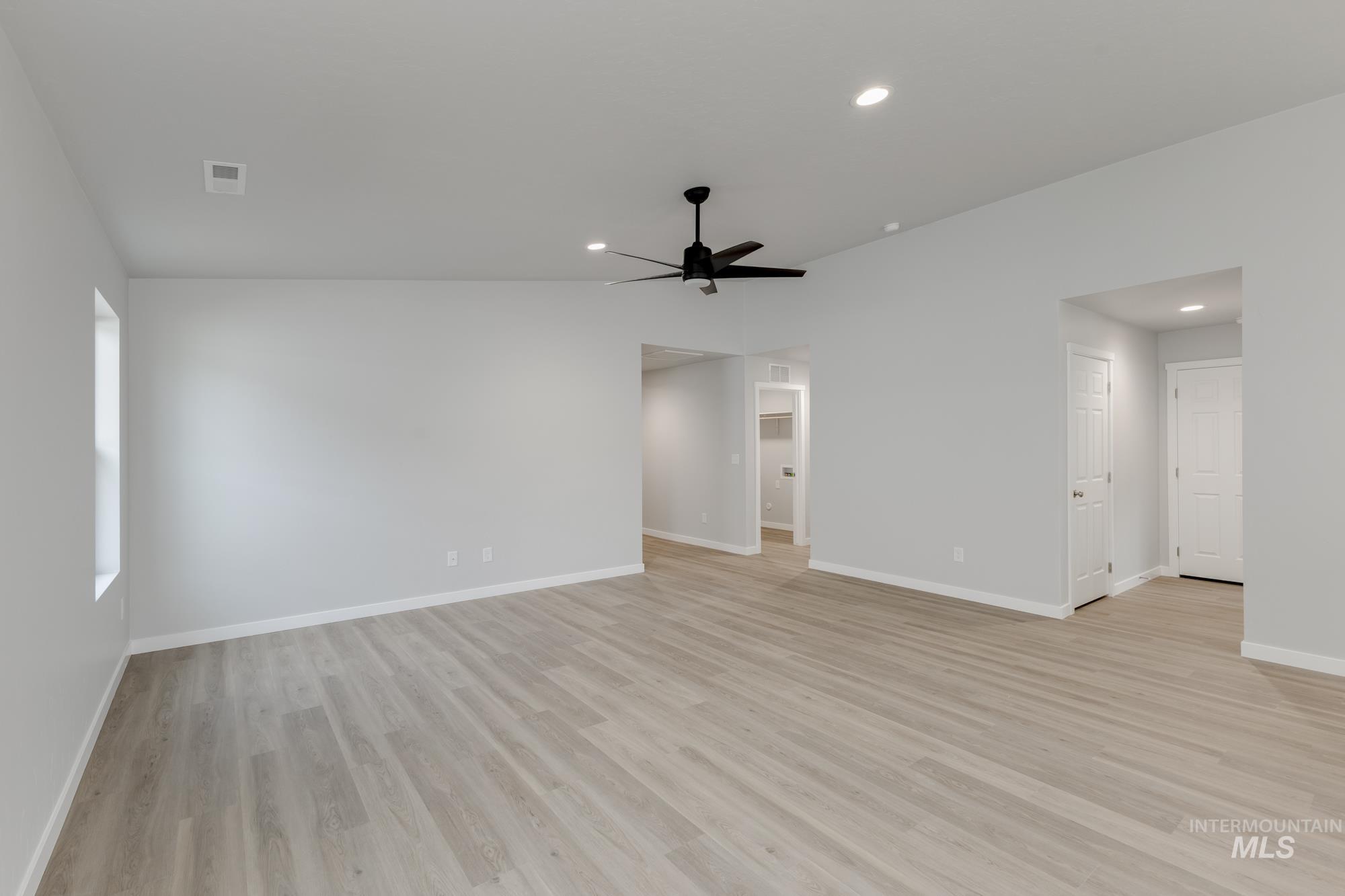 Spare room featuring light wood-style flooring, recessed lighting, and a ceiling fan