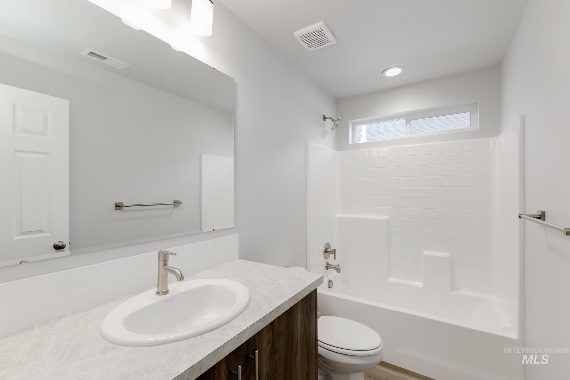 Bathroom featuring shower / bathtub combination and vanity