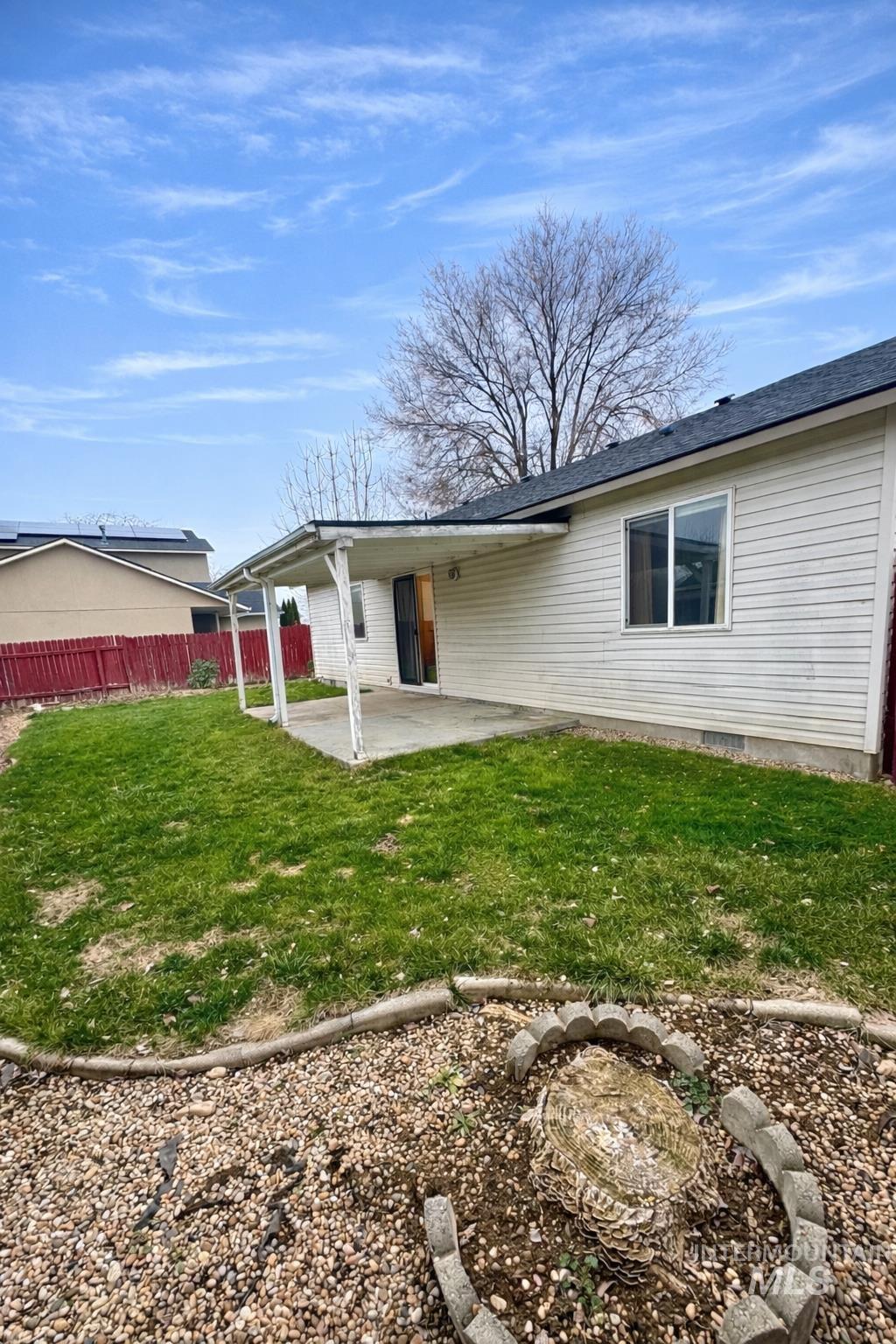 Back of house with a patio area