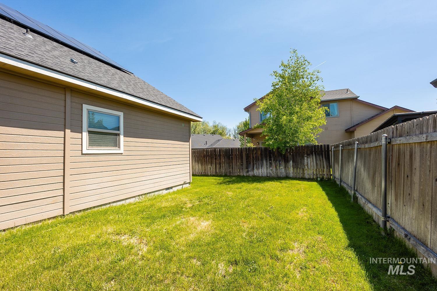View of fenced backyard