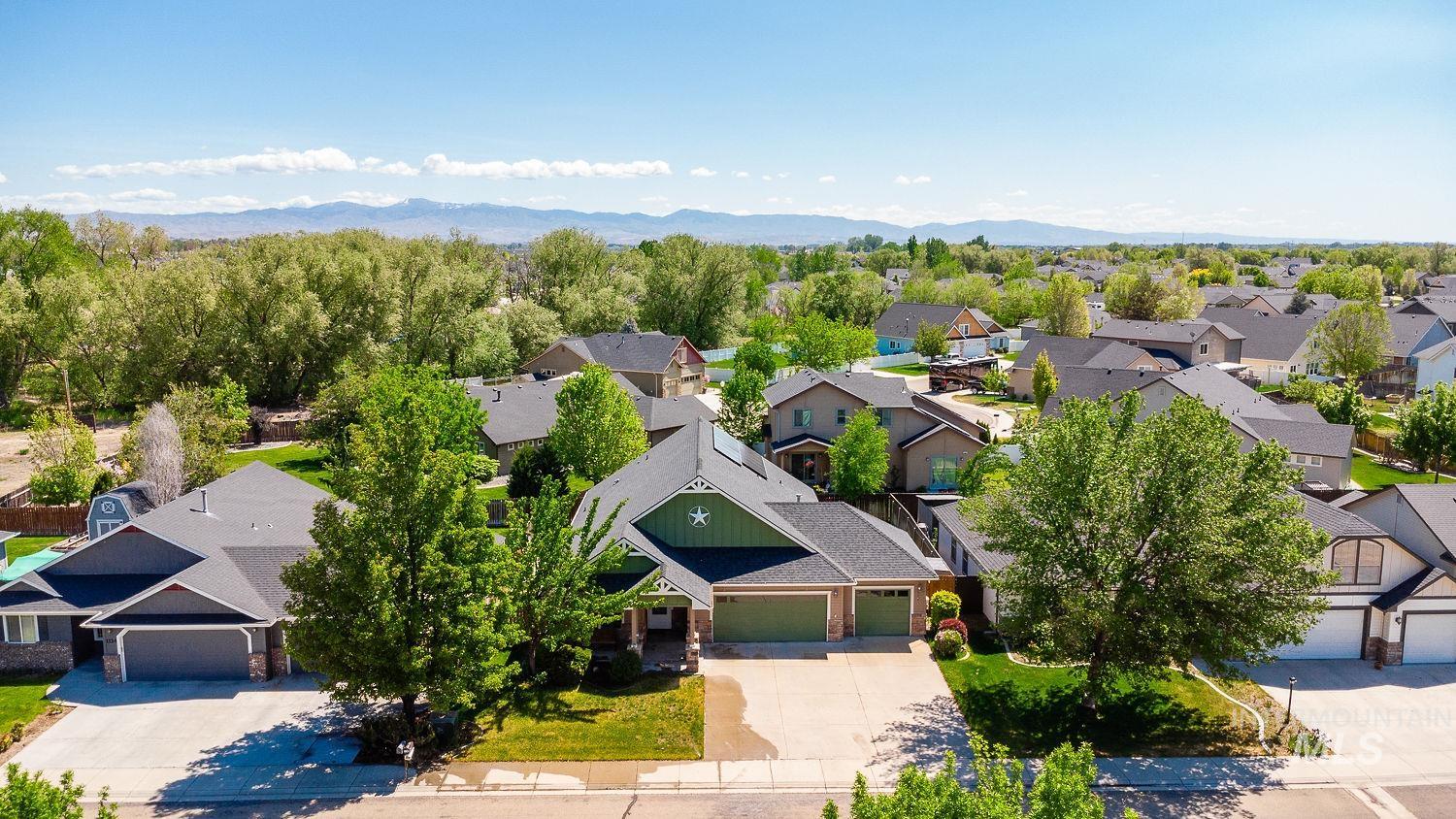 Aerial view of residential area with a mountain backdrop