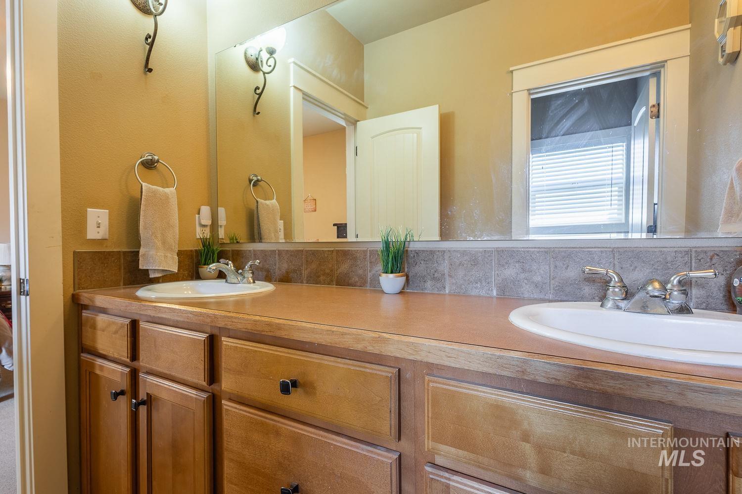 Bathroom featuring double vanity