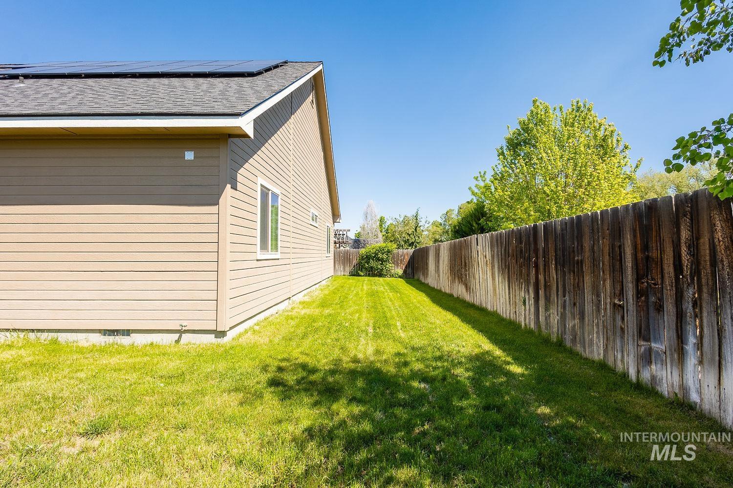View of fenced backyard
