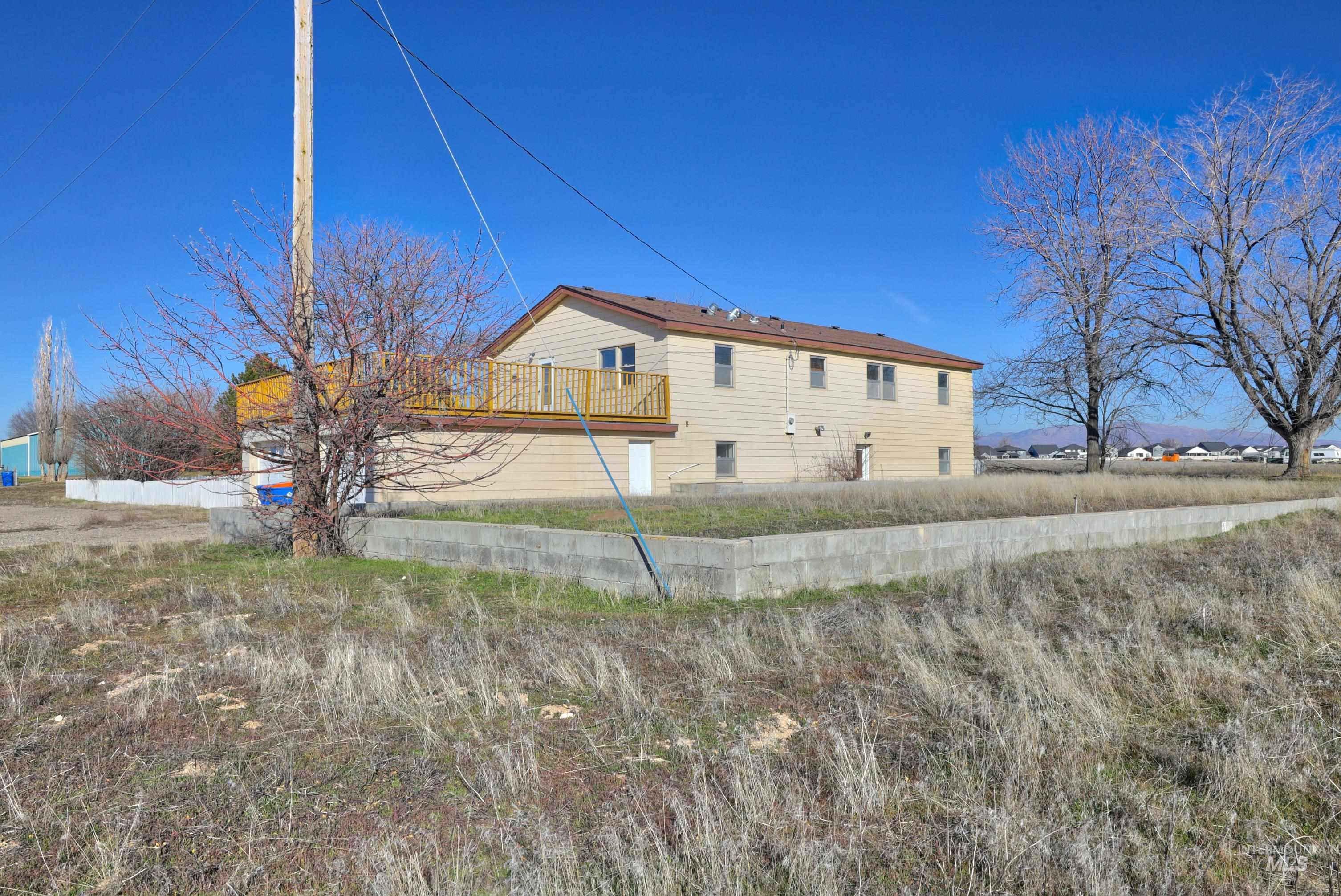 Back of house featuring a wooden deck
