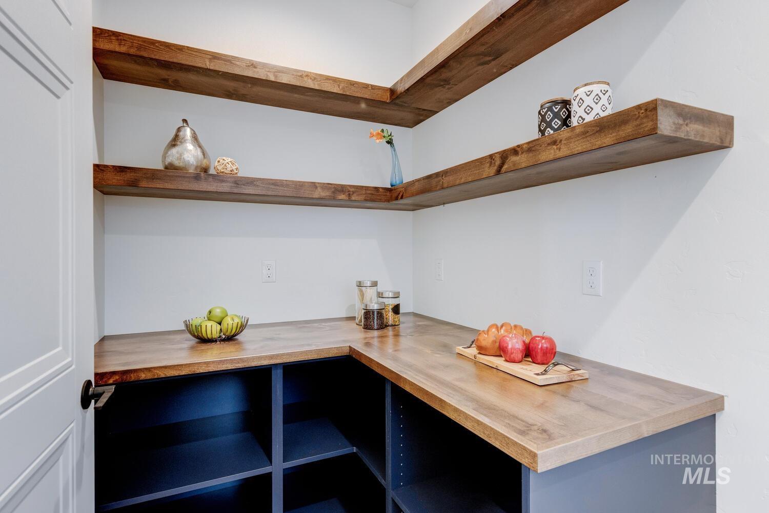 Kitchen featuring wood counters and open shelves