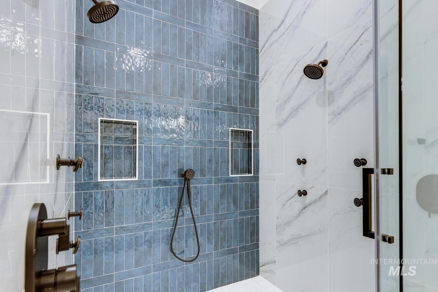 Bathroom featuring a marble finish shower