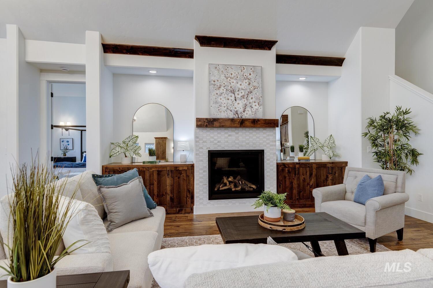 Living area with wood finished floors, a fireplace, and recessed lighting
