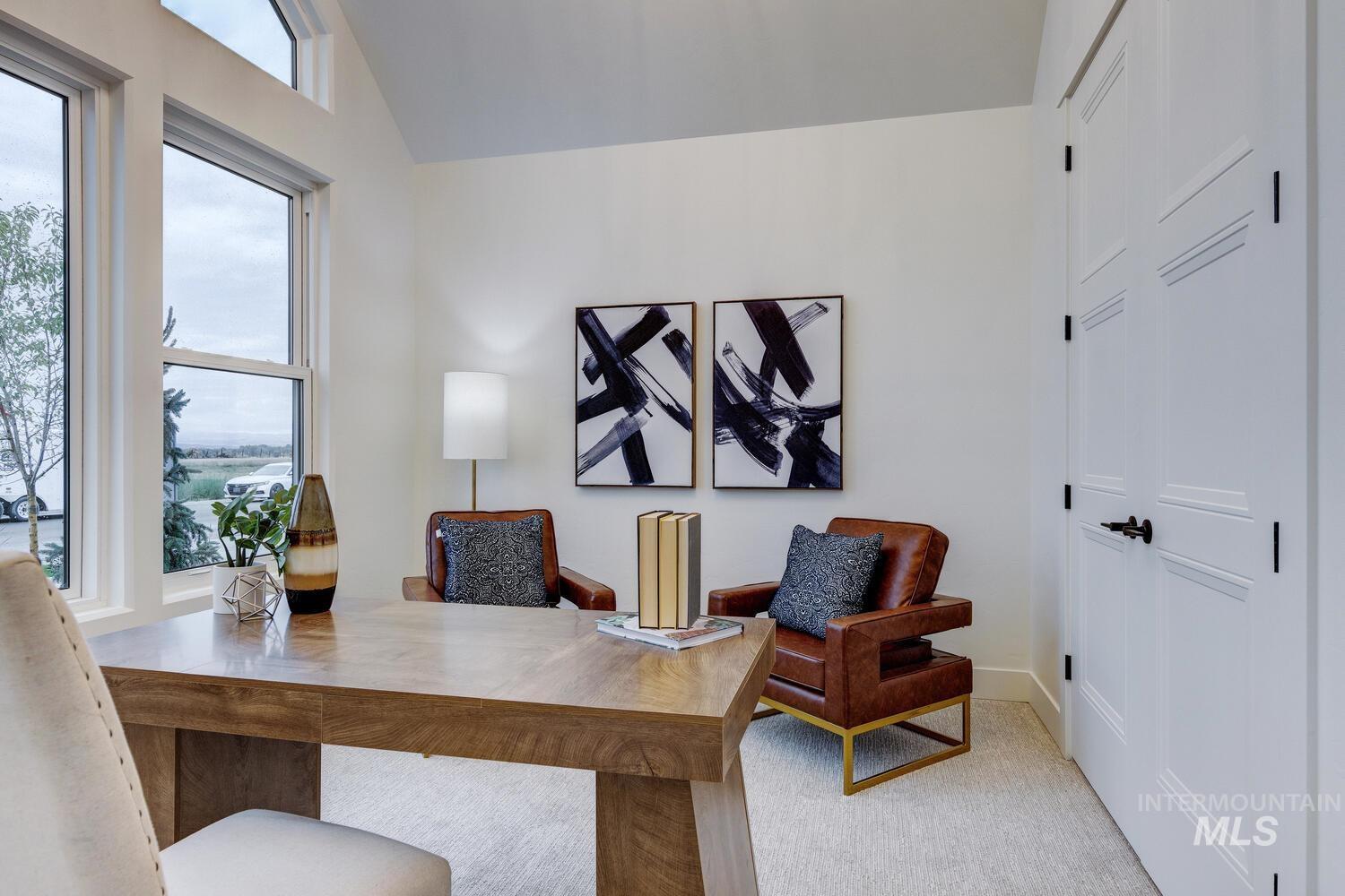 Office space featuring lofted ceiling