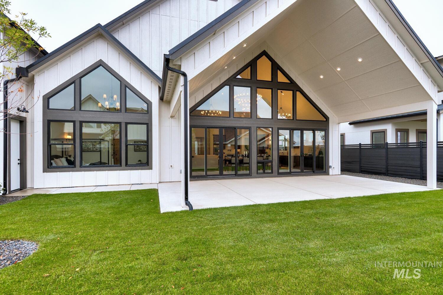 Back of property with a patio