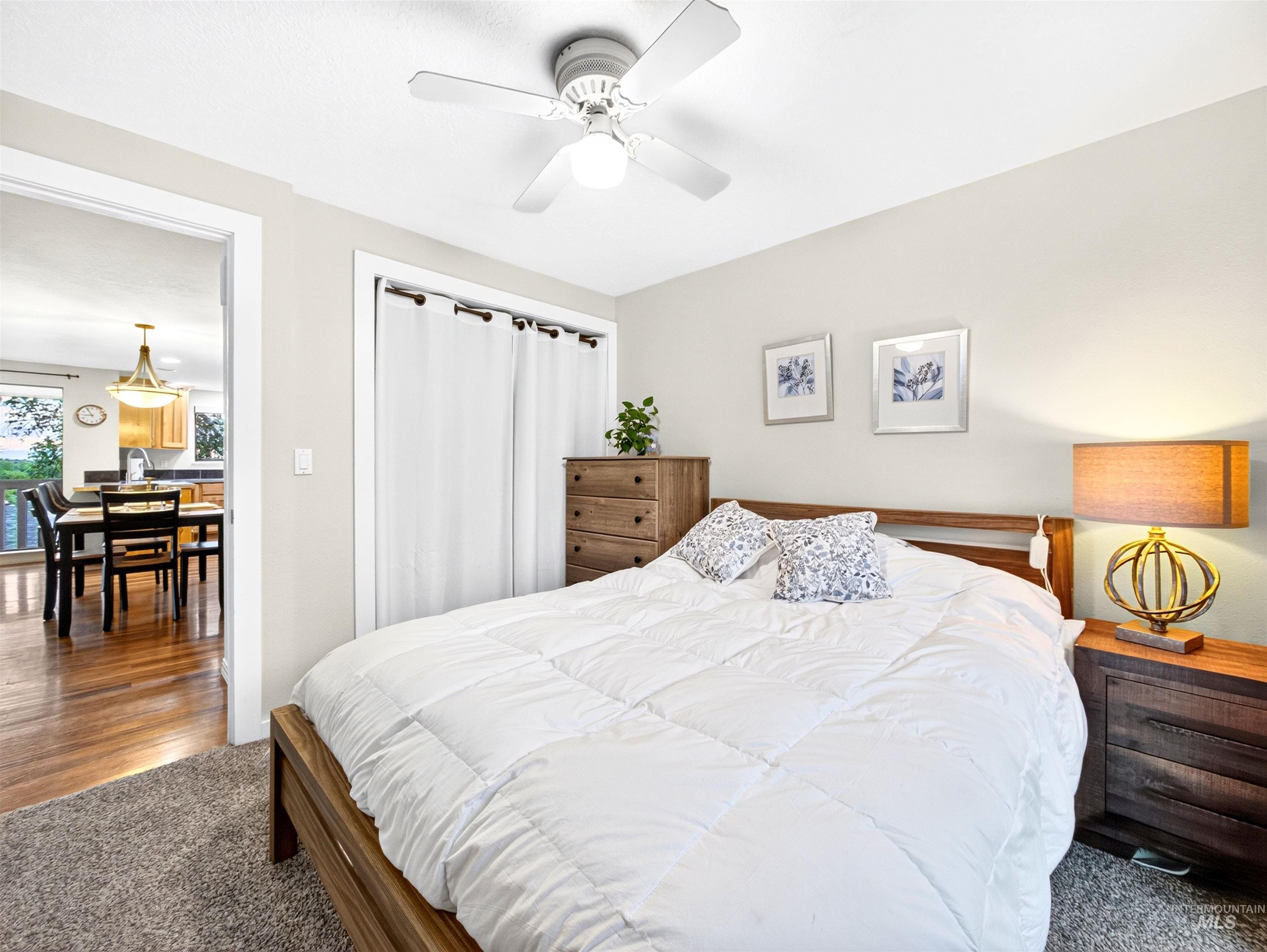 Bedroom featuring carpeted flooring and an overhead ceiling fan