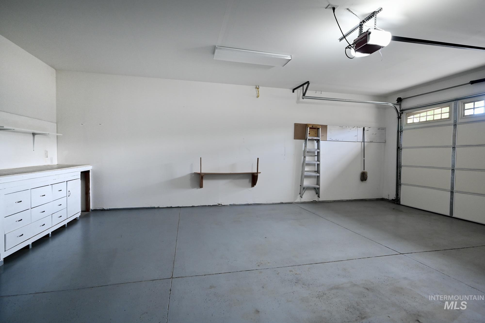 Garage featuring a garage door opener