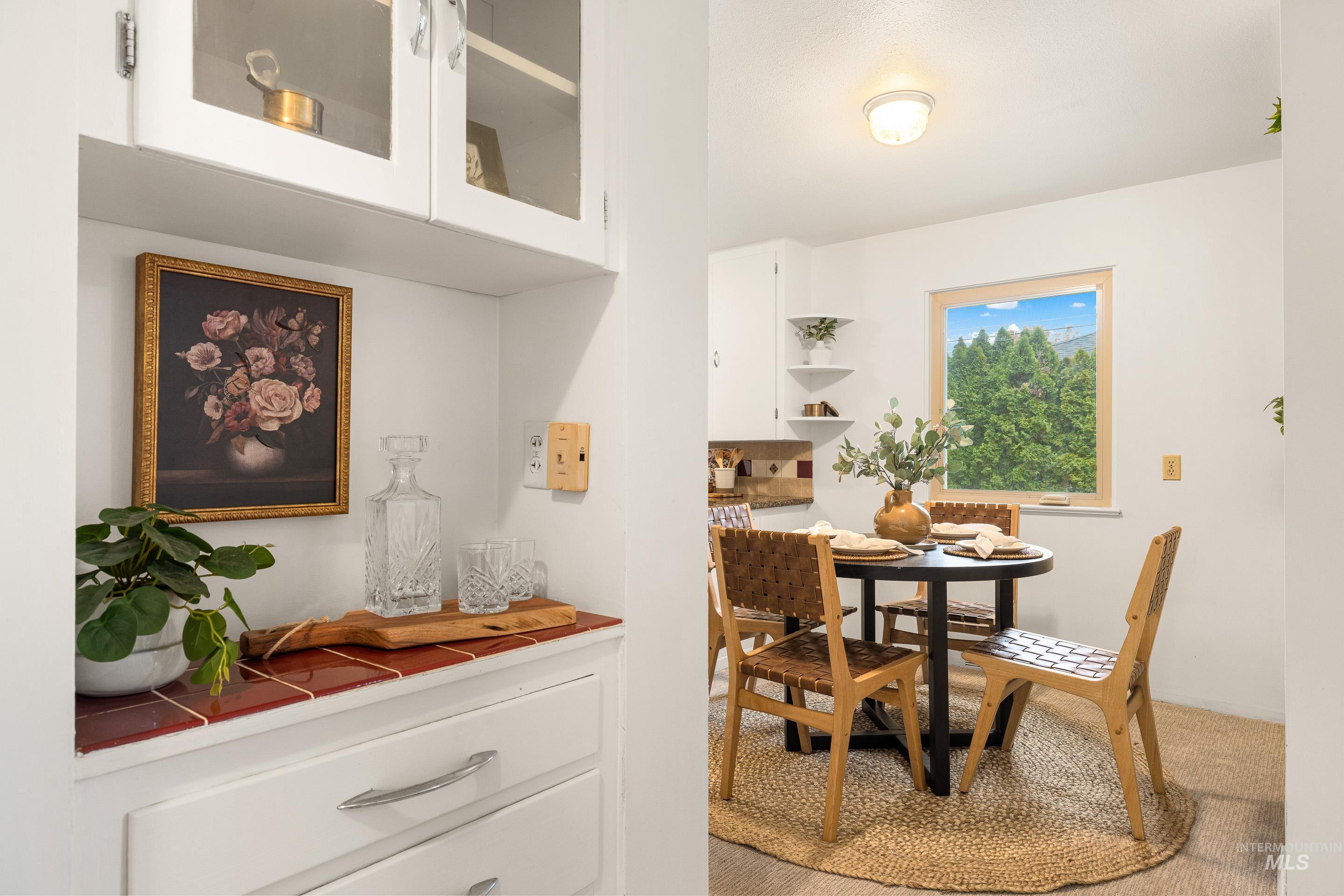 Dining area featuring light colored carpet