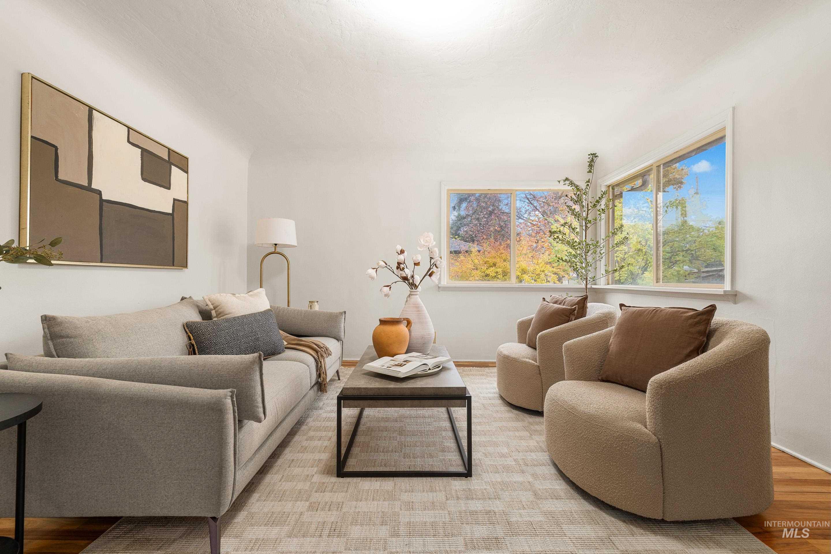 Living area featuring light wood-style flooring and baseboards