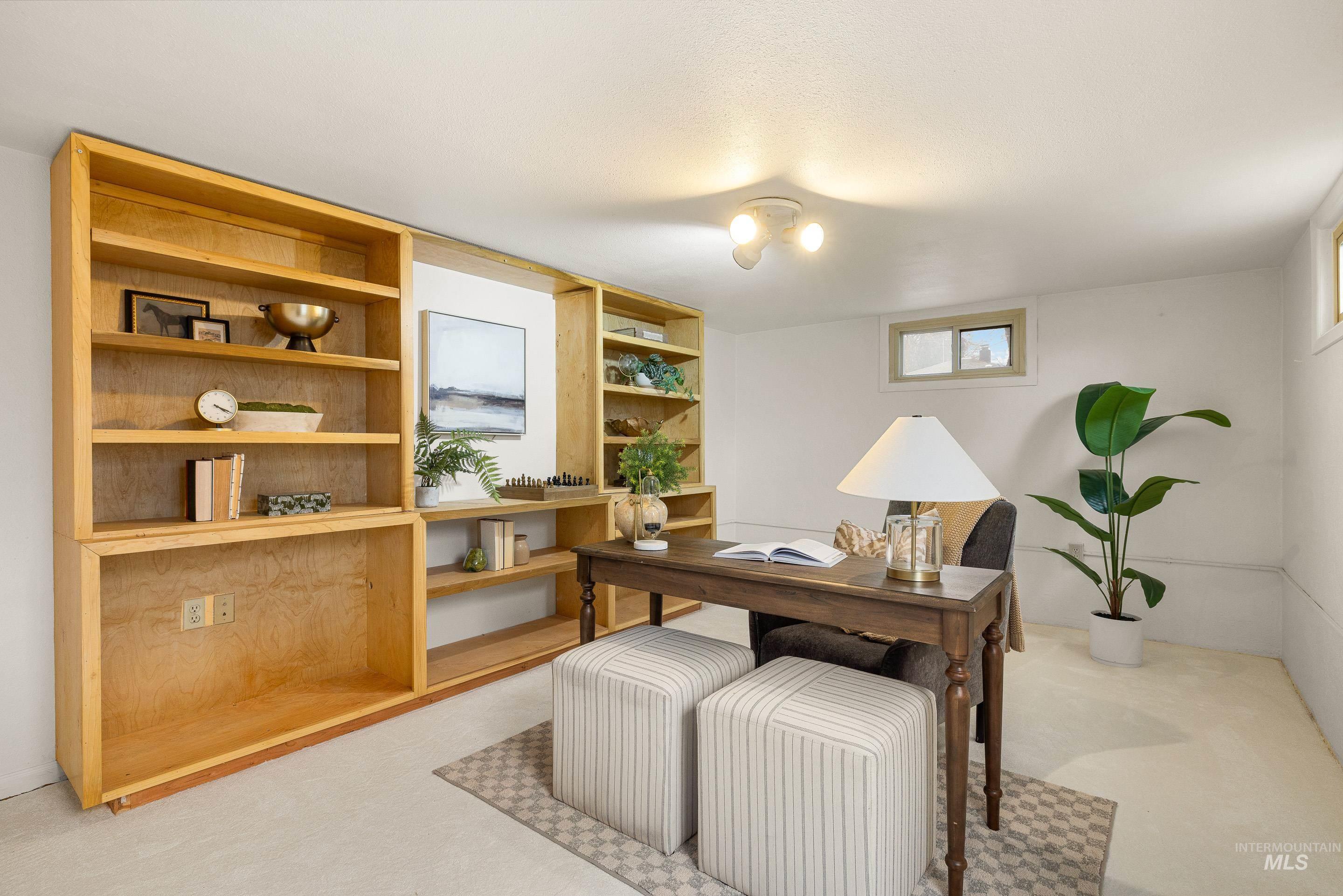 Home office featuring light colored carpet