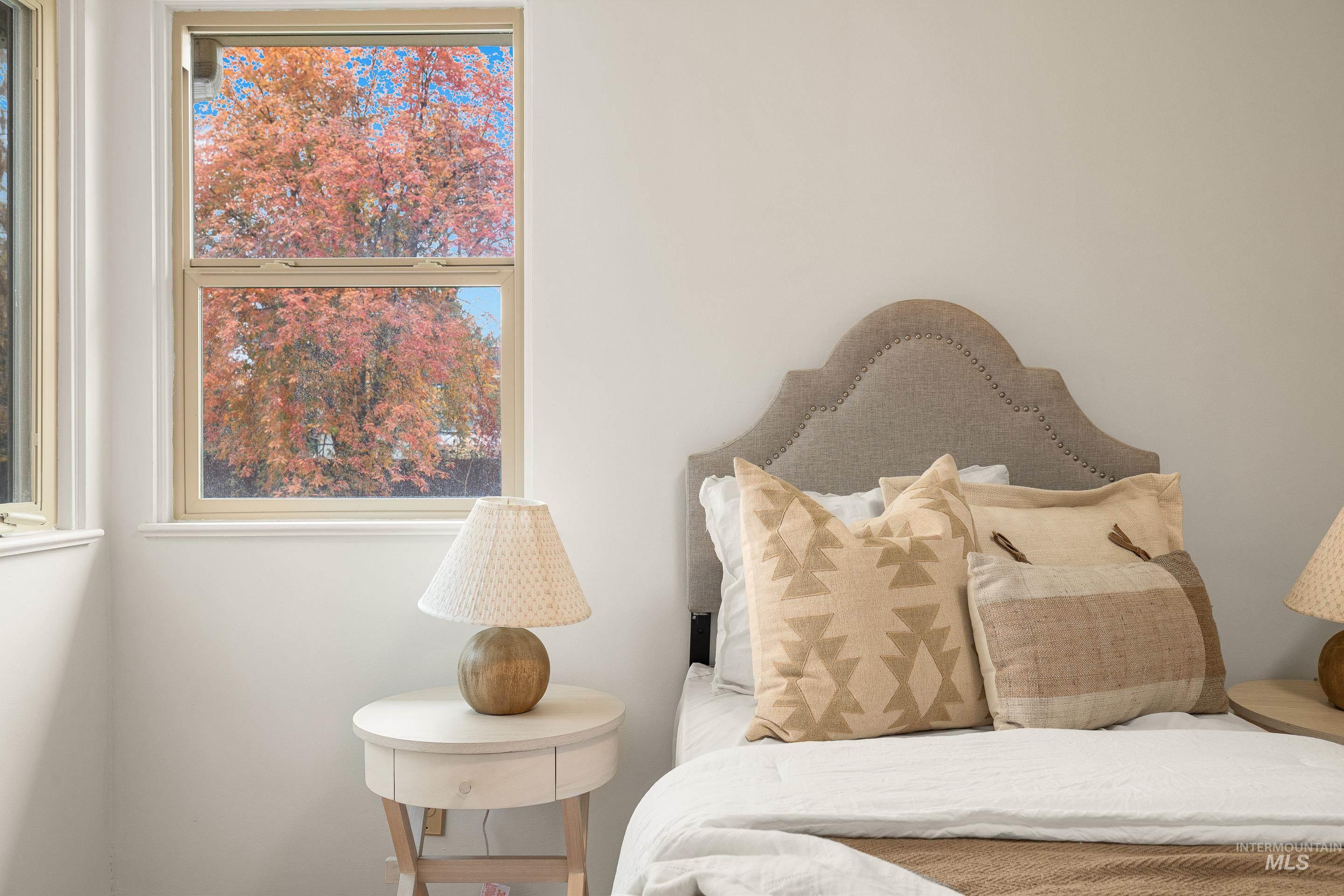 Bedroom featuring multiple windows