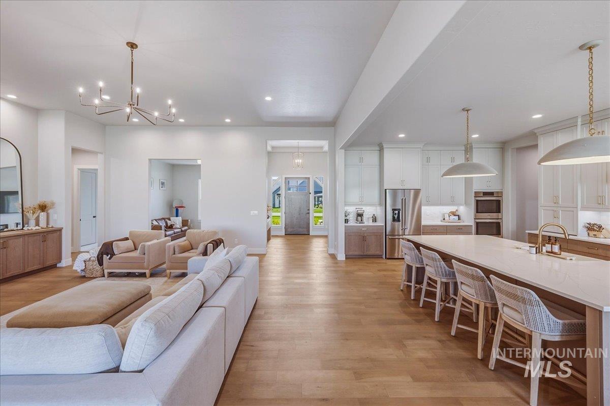 Open-concept living space with wood-finish flooring throughout