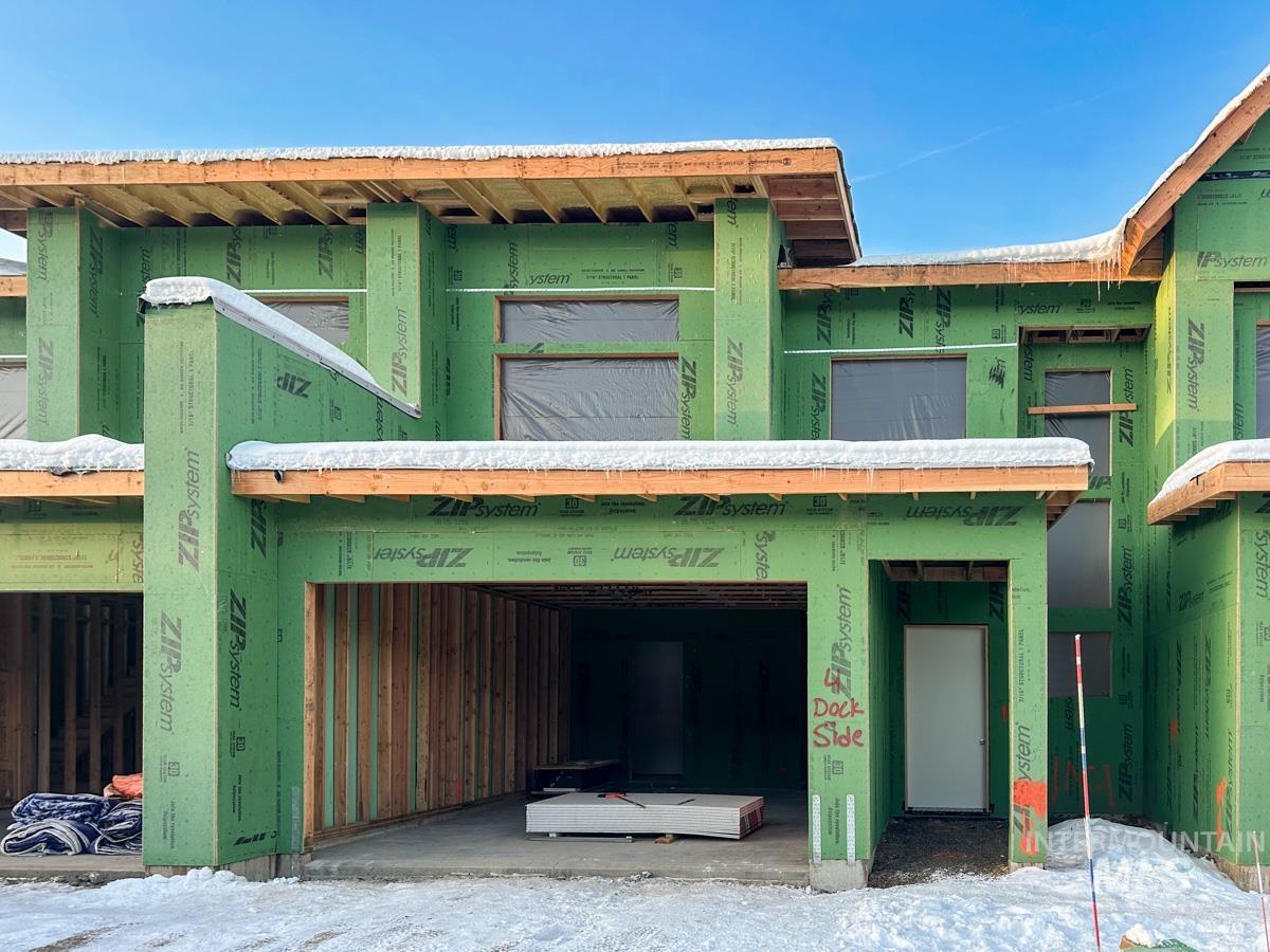 Back of property with a garage