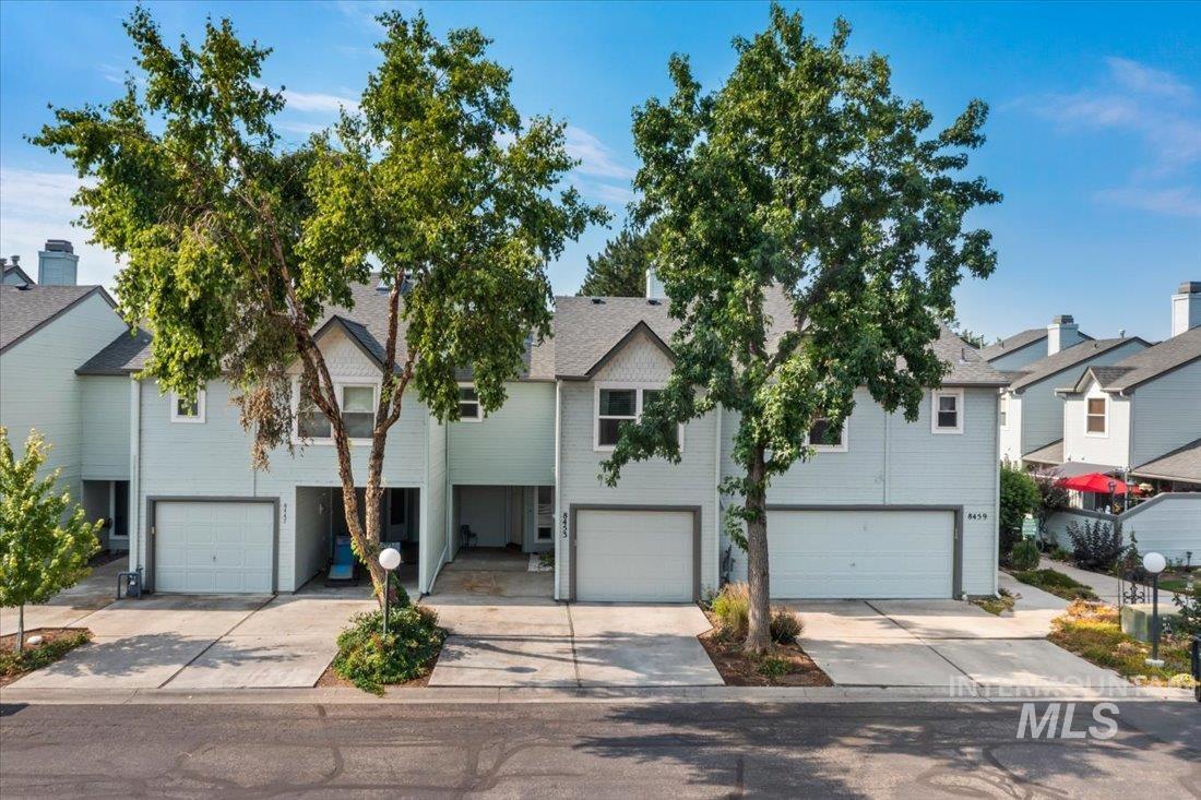 View of front of home featuring an attached garage and driveway