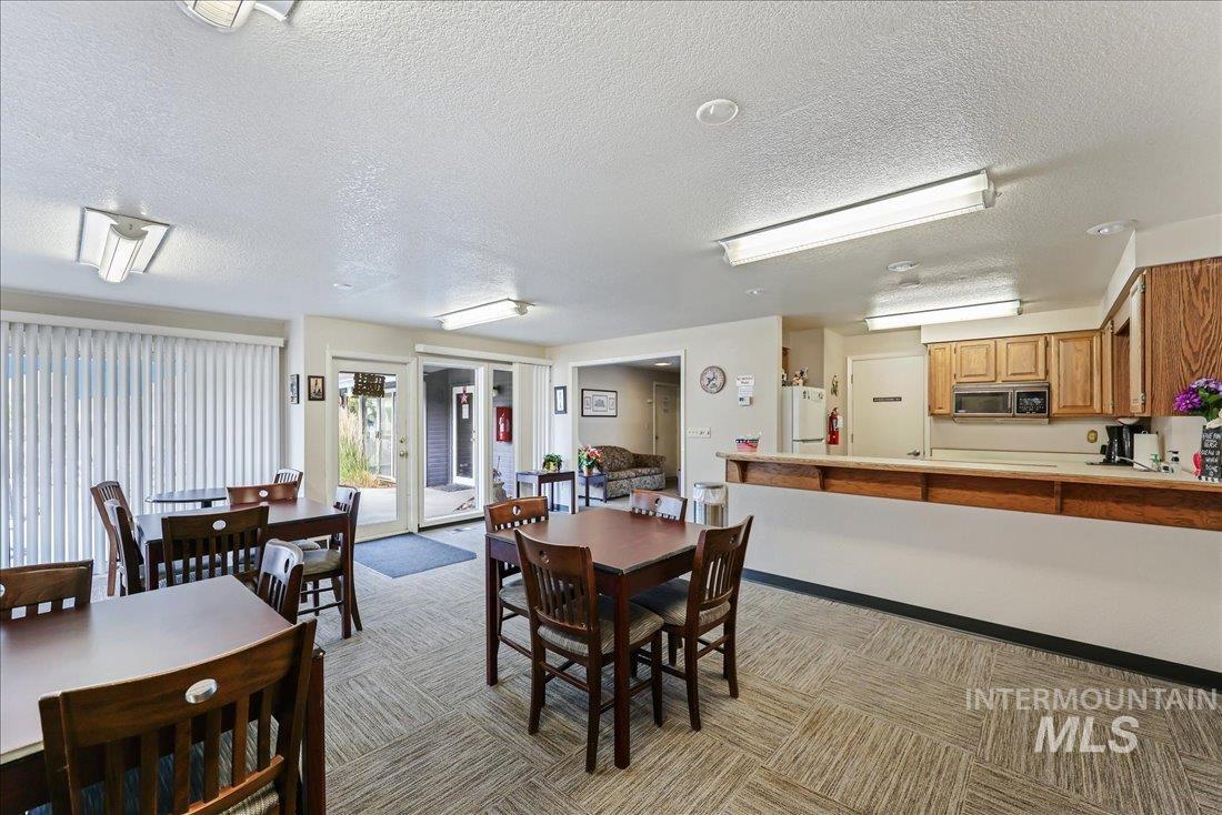 Dining space featuring a textured ceiling