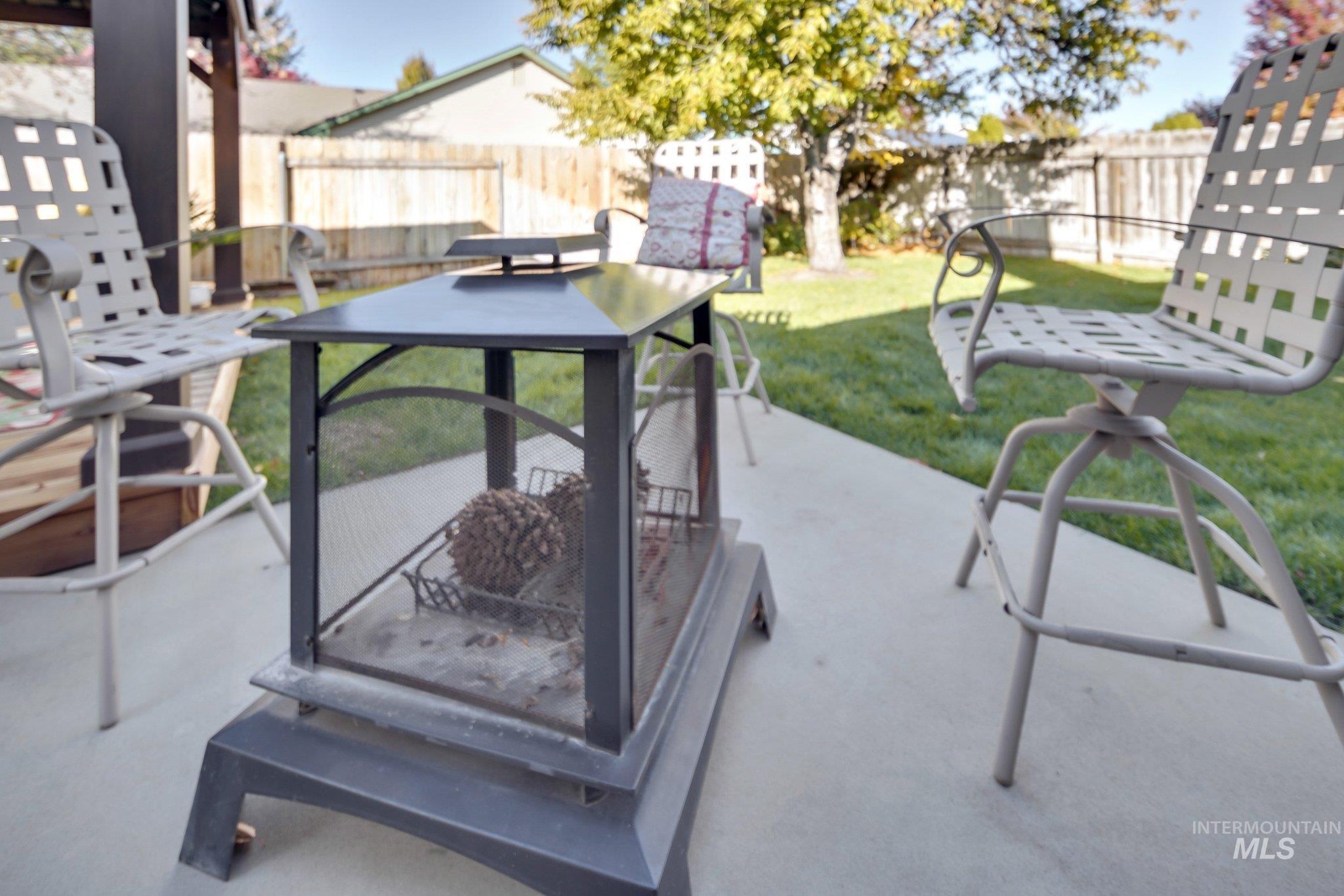 Fenced backyard featuring a patio area and outdoor dining space