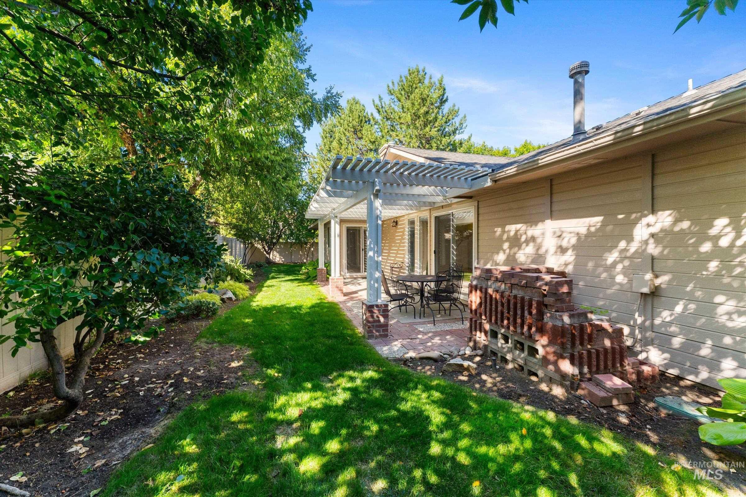 View of yard featuring a patio and a pergola