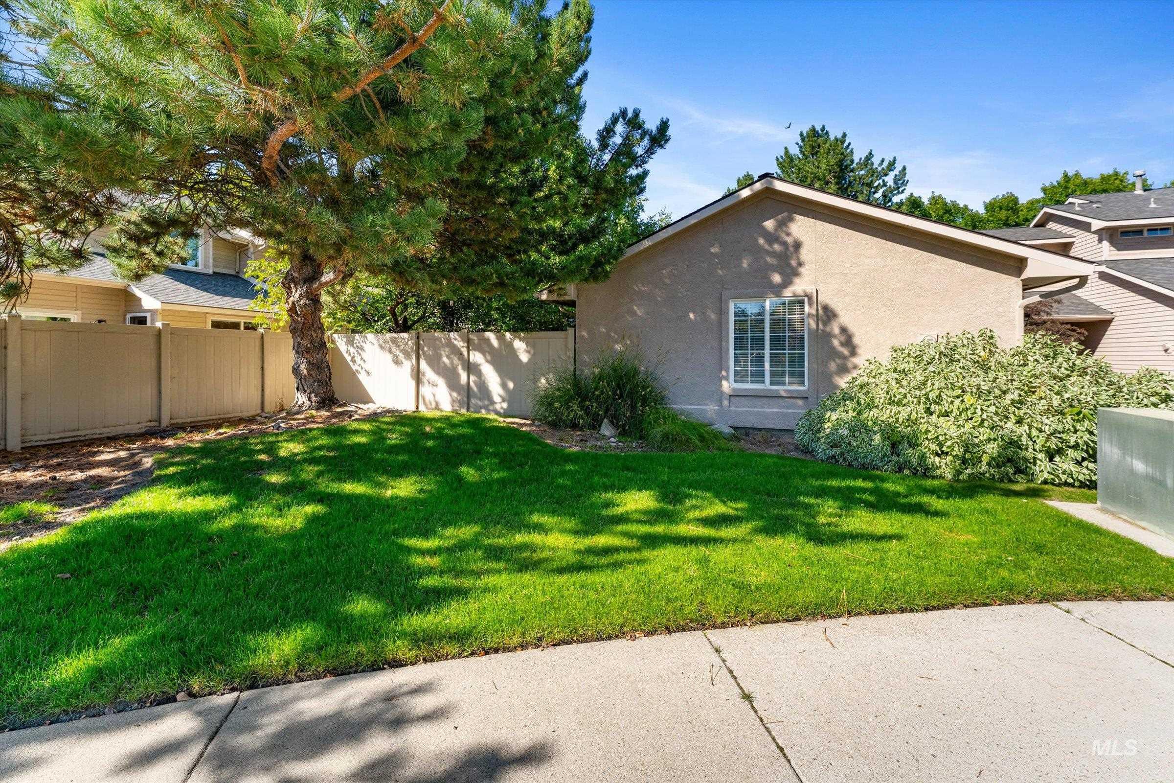View of side of property featuring stucco siding