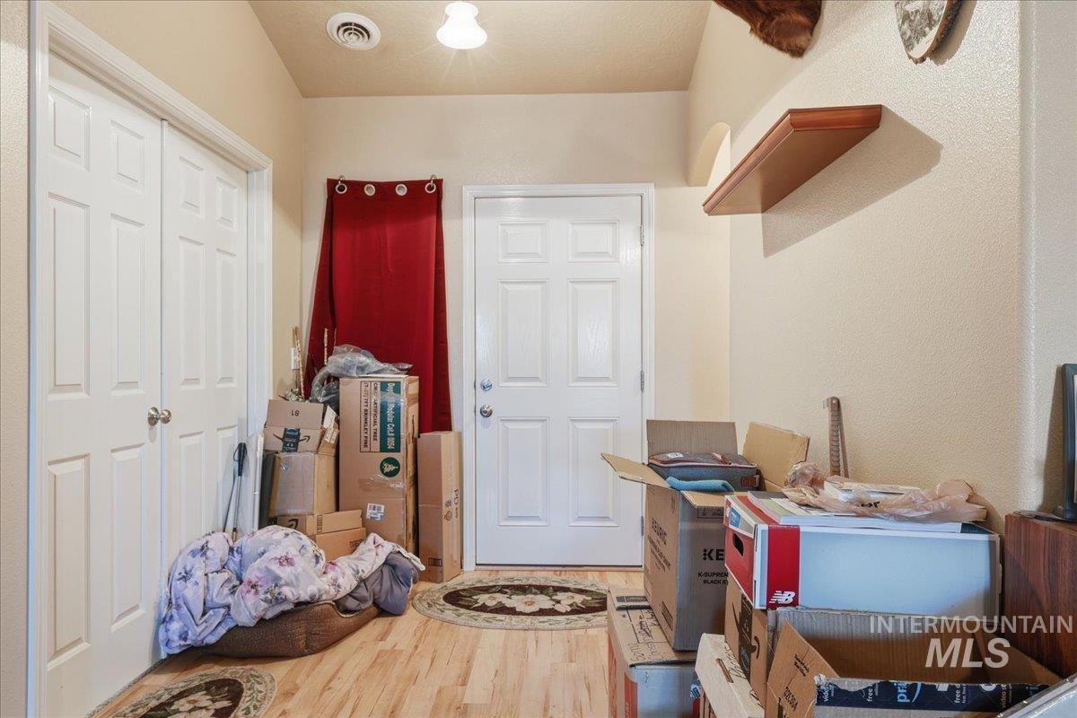 Foyer featuring wood finished floors