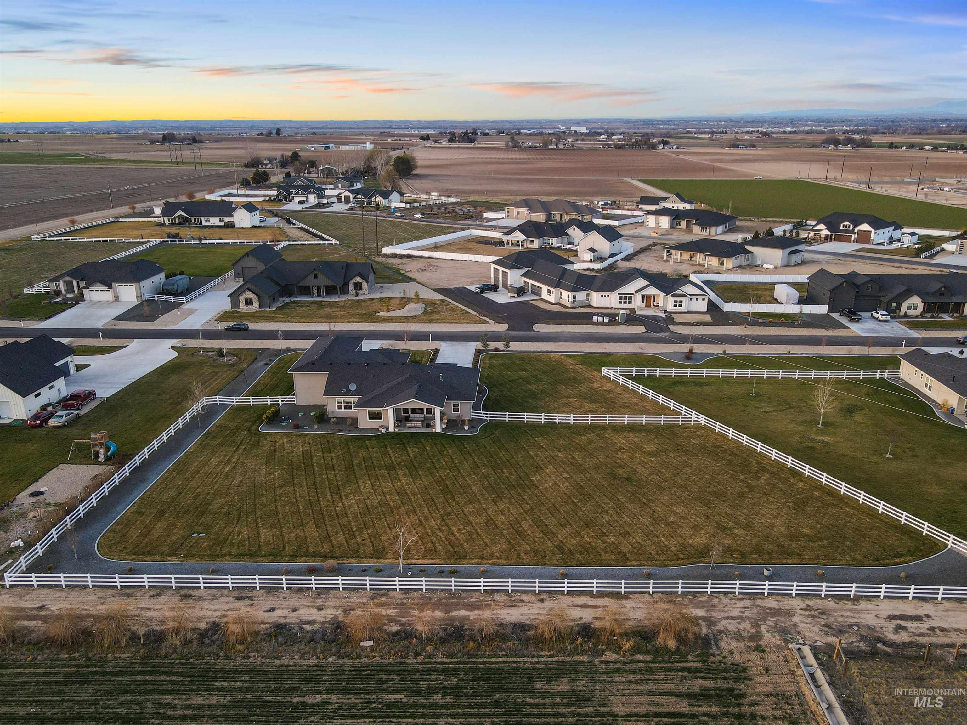 Aerial view at dusk of a residential view and a rural view