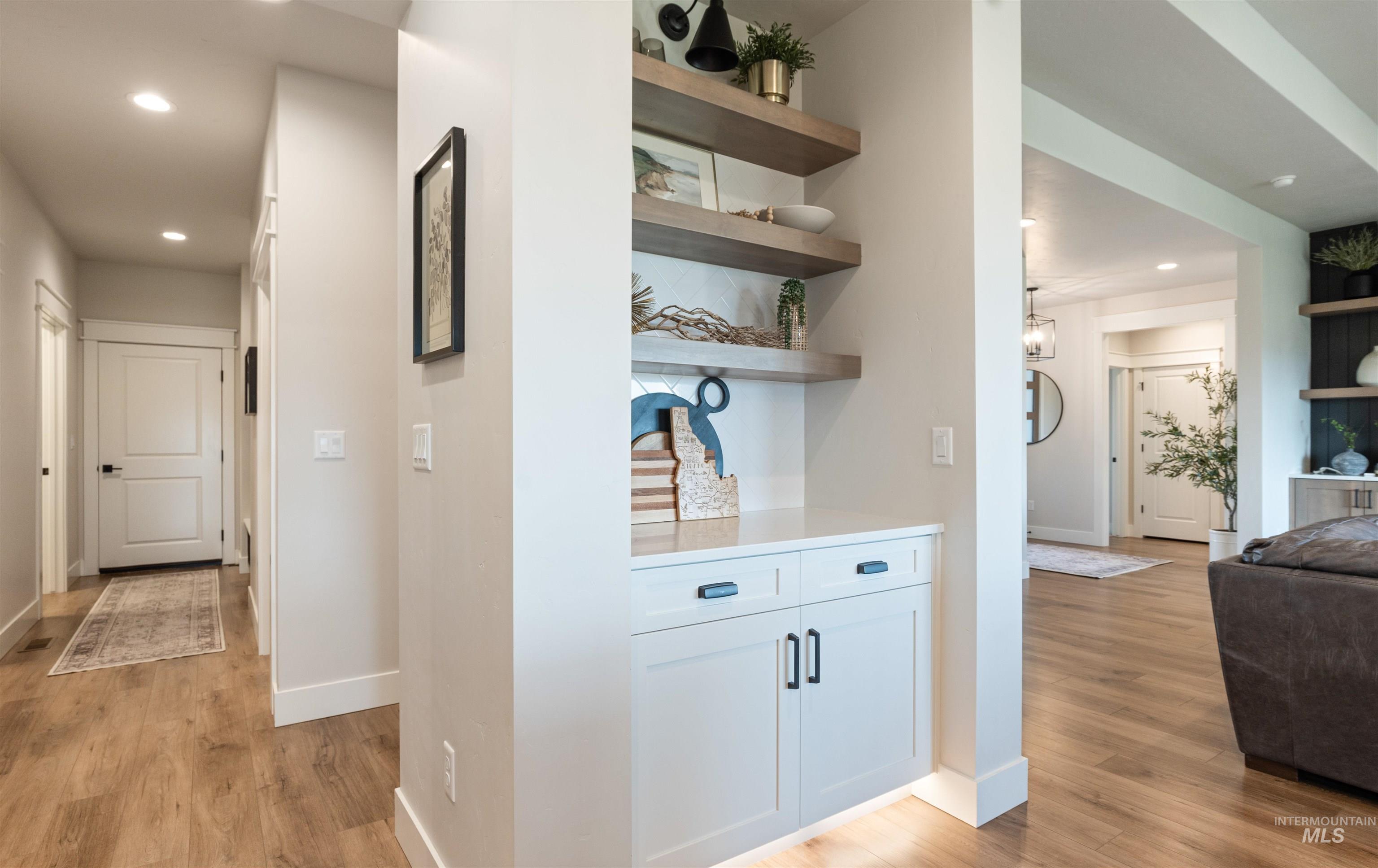 Hall featuring recessed lighting and light wood-type flooring