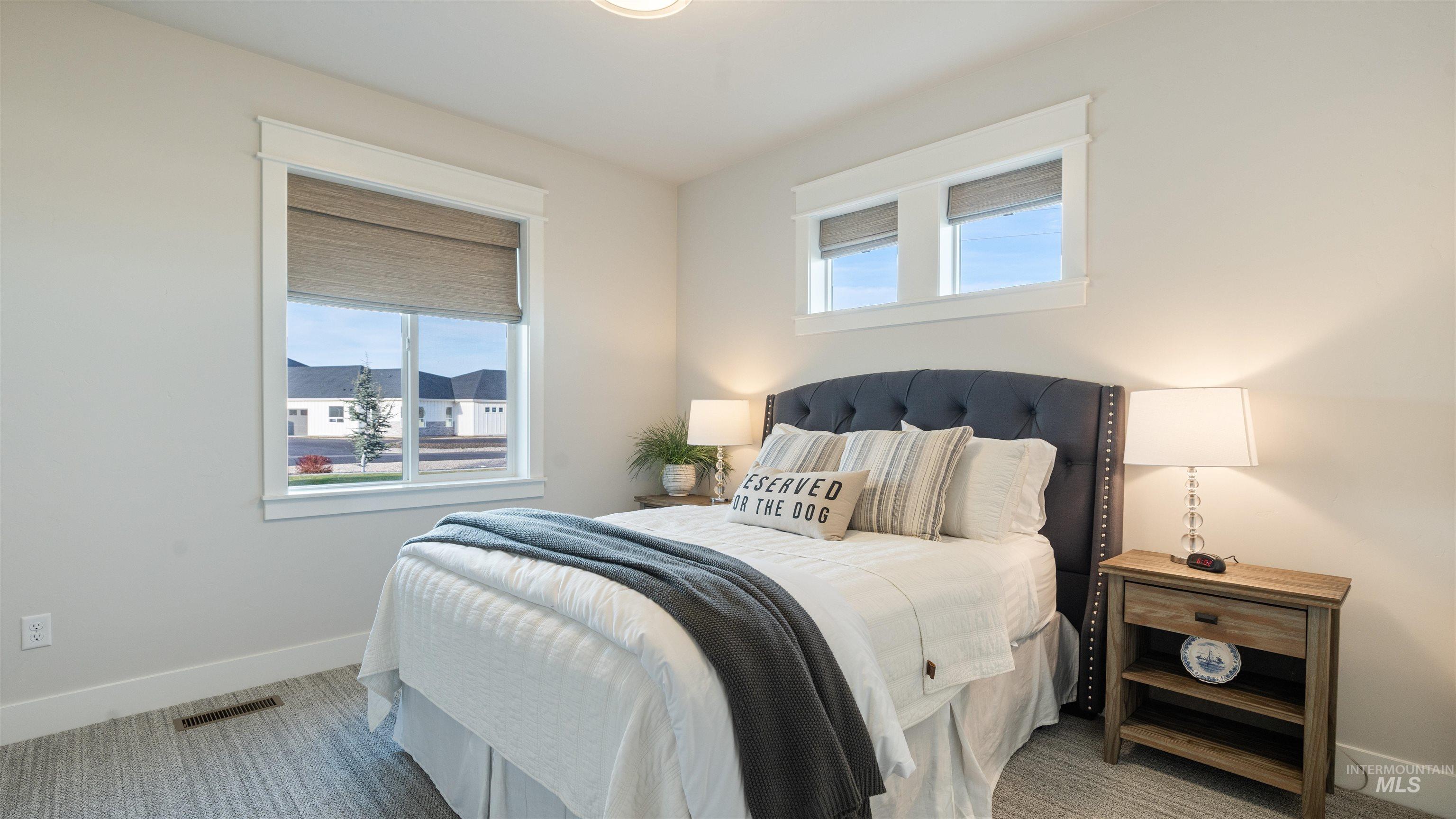 Bedroom featuring multiple windows
