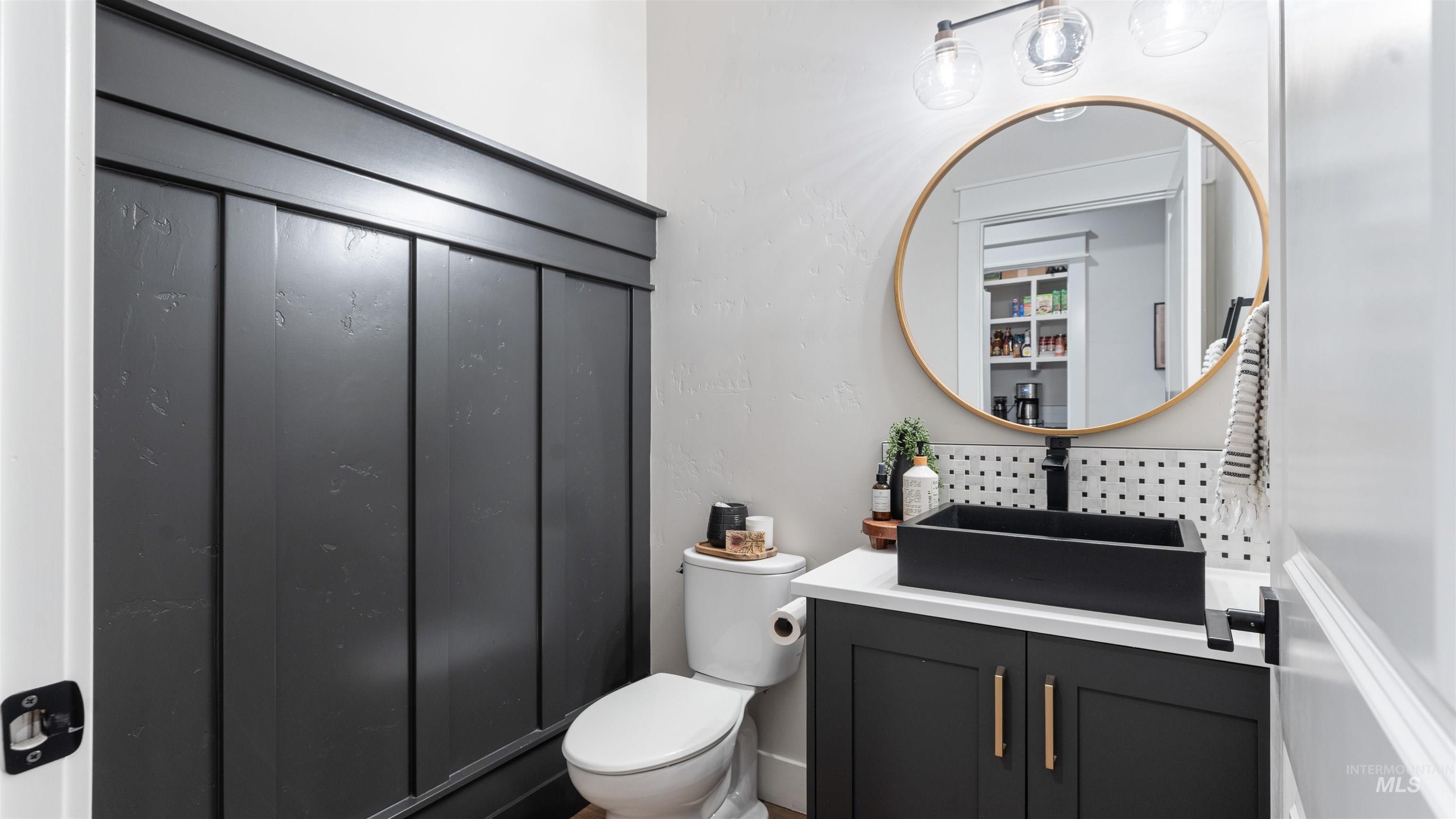 Bathroom featuring toilet and vanity