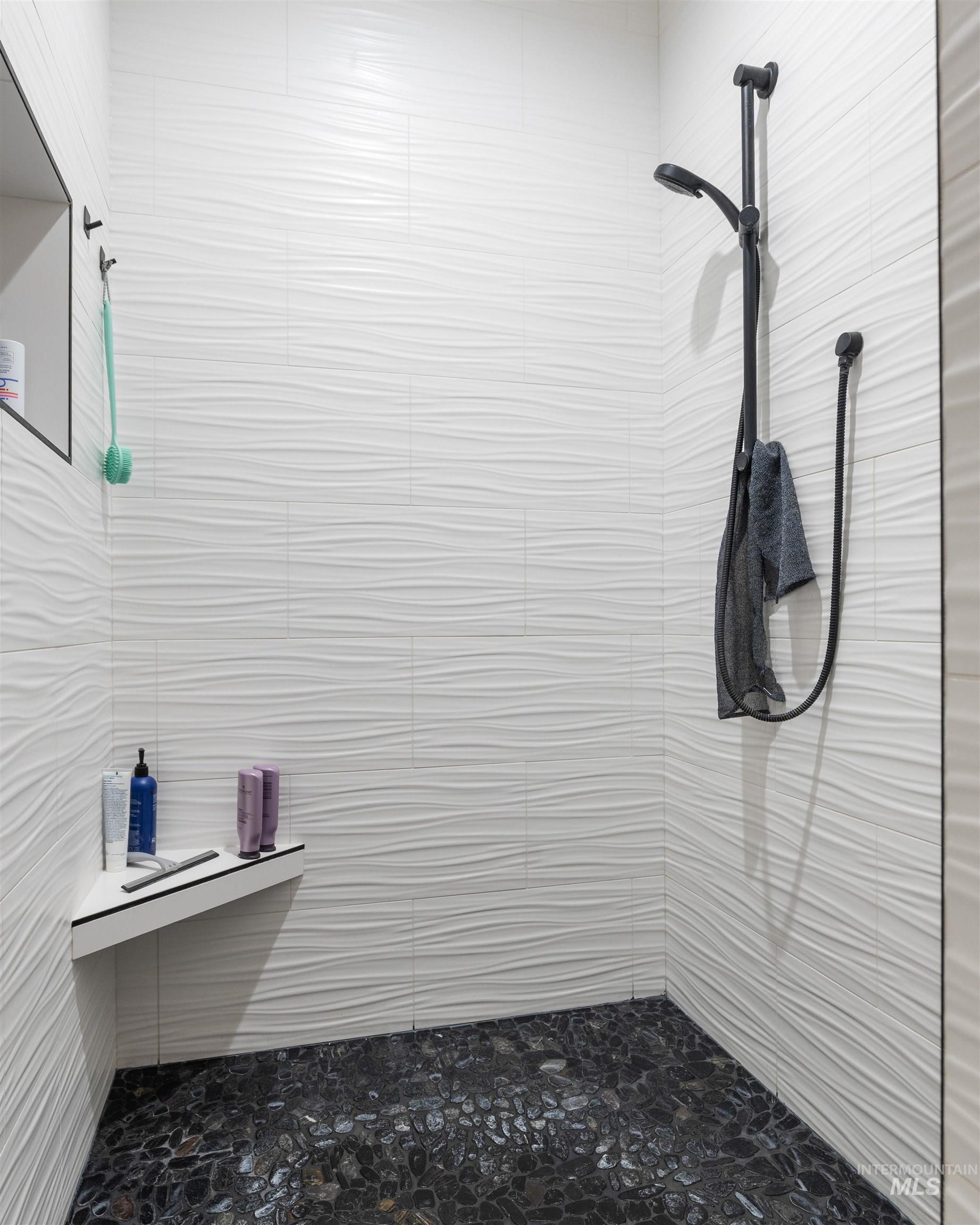 Full bath with tiled shower