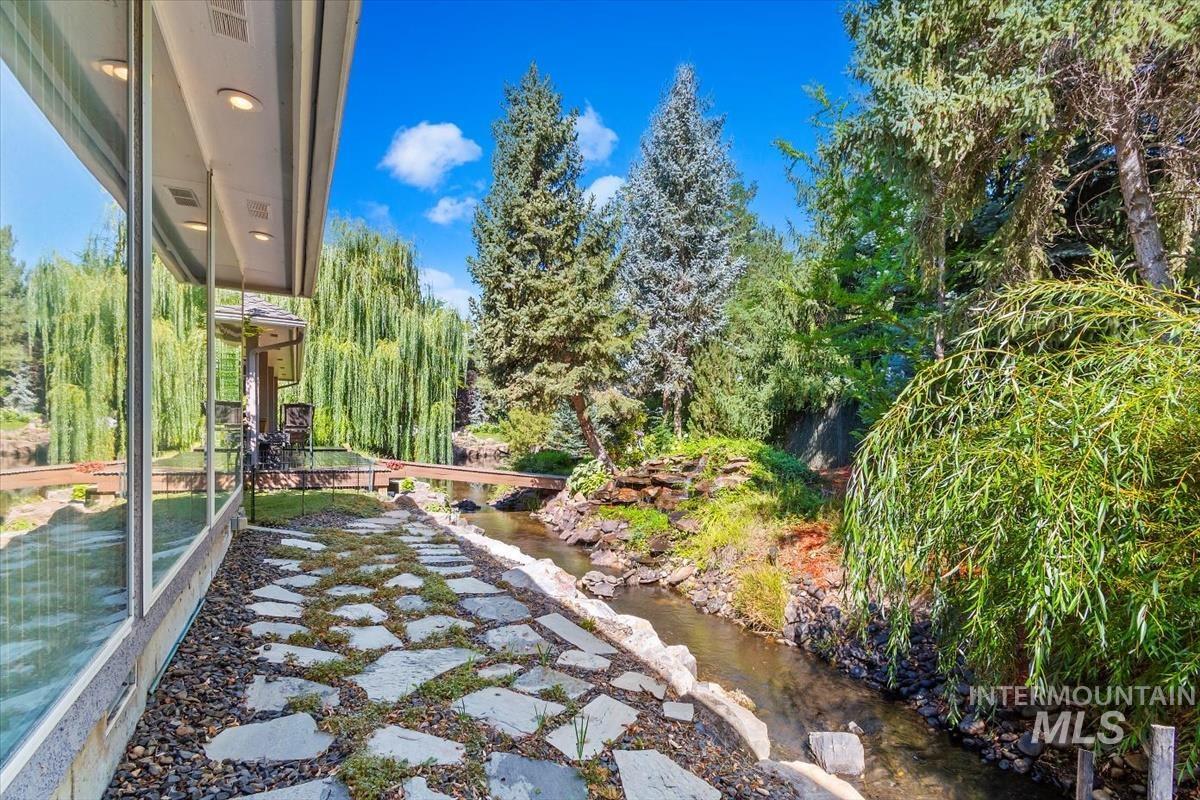 View of yard with a water view