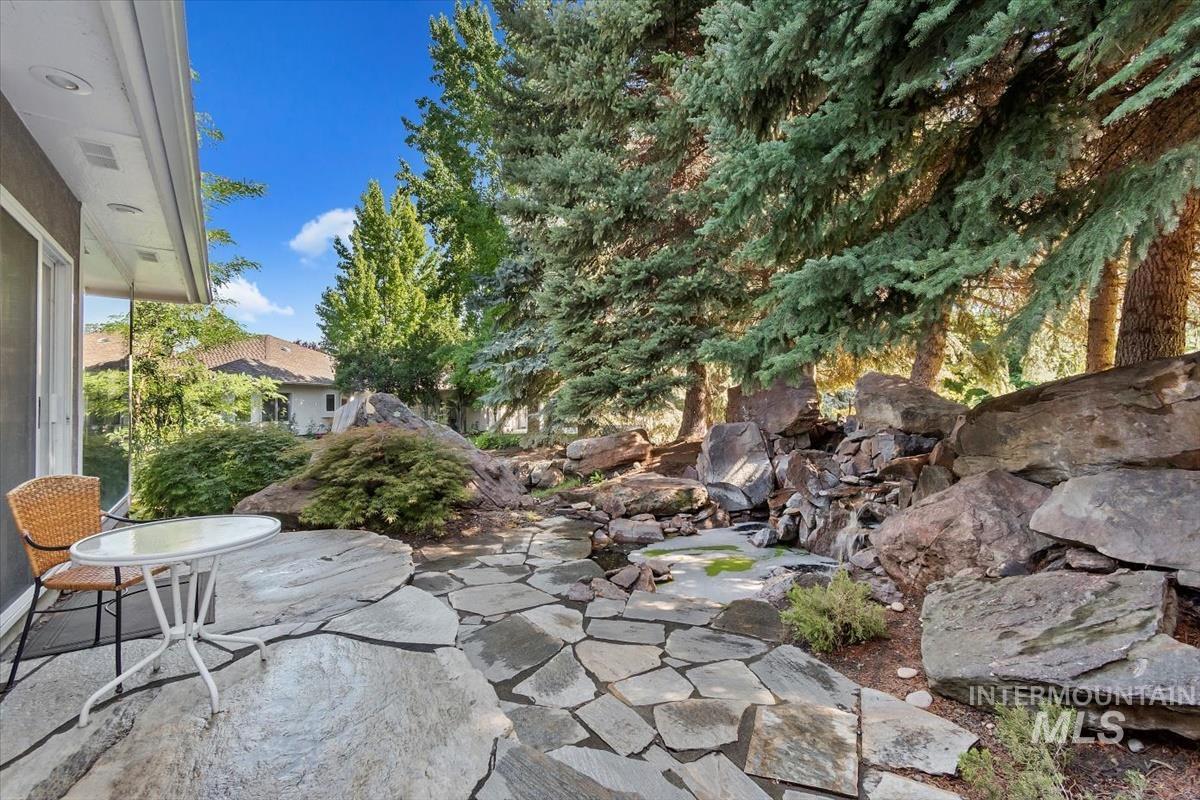 View of patio / terrace featuring a garden pond