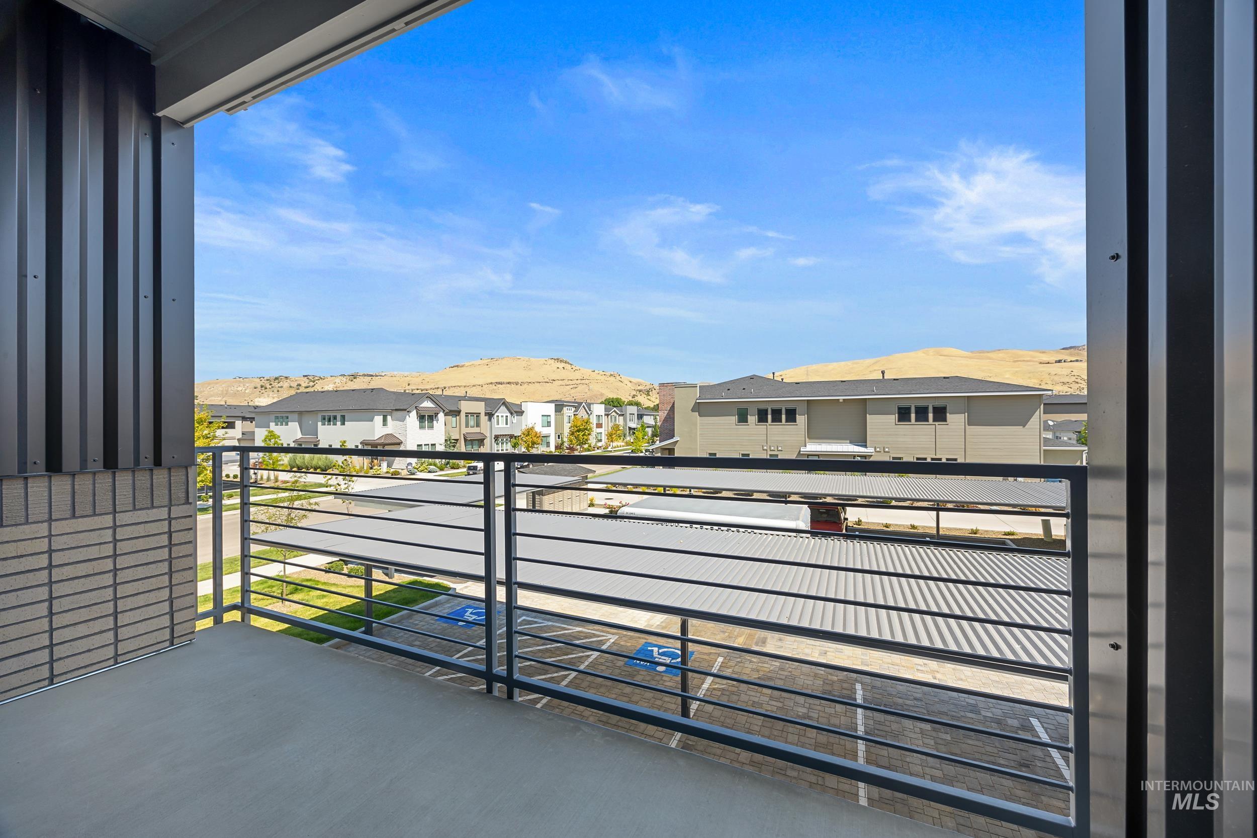 Balcony featuring a mountain view and a residential view