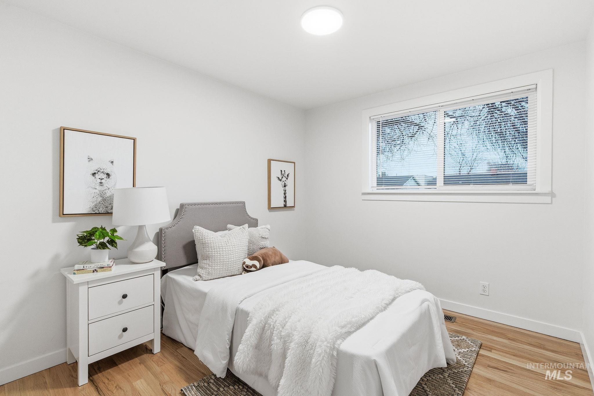 Bedroom with light wood finished floors