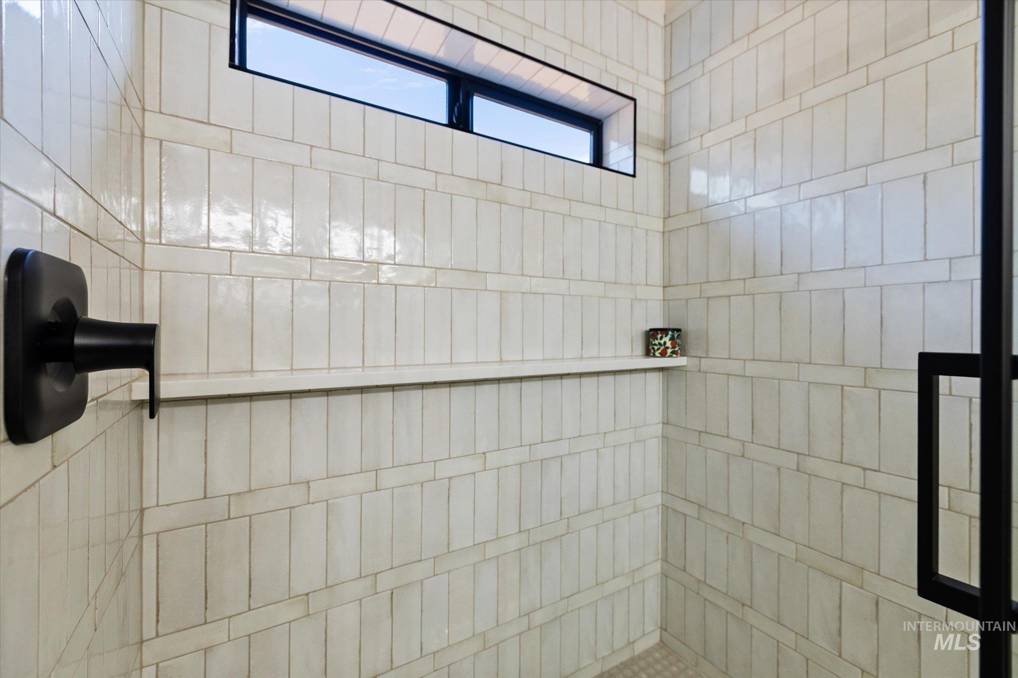 Full bathroom with a tile shower