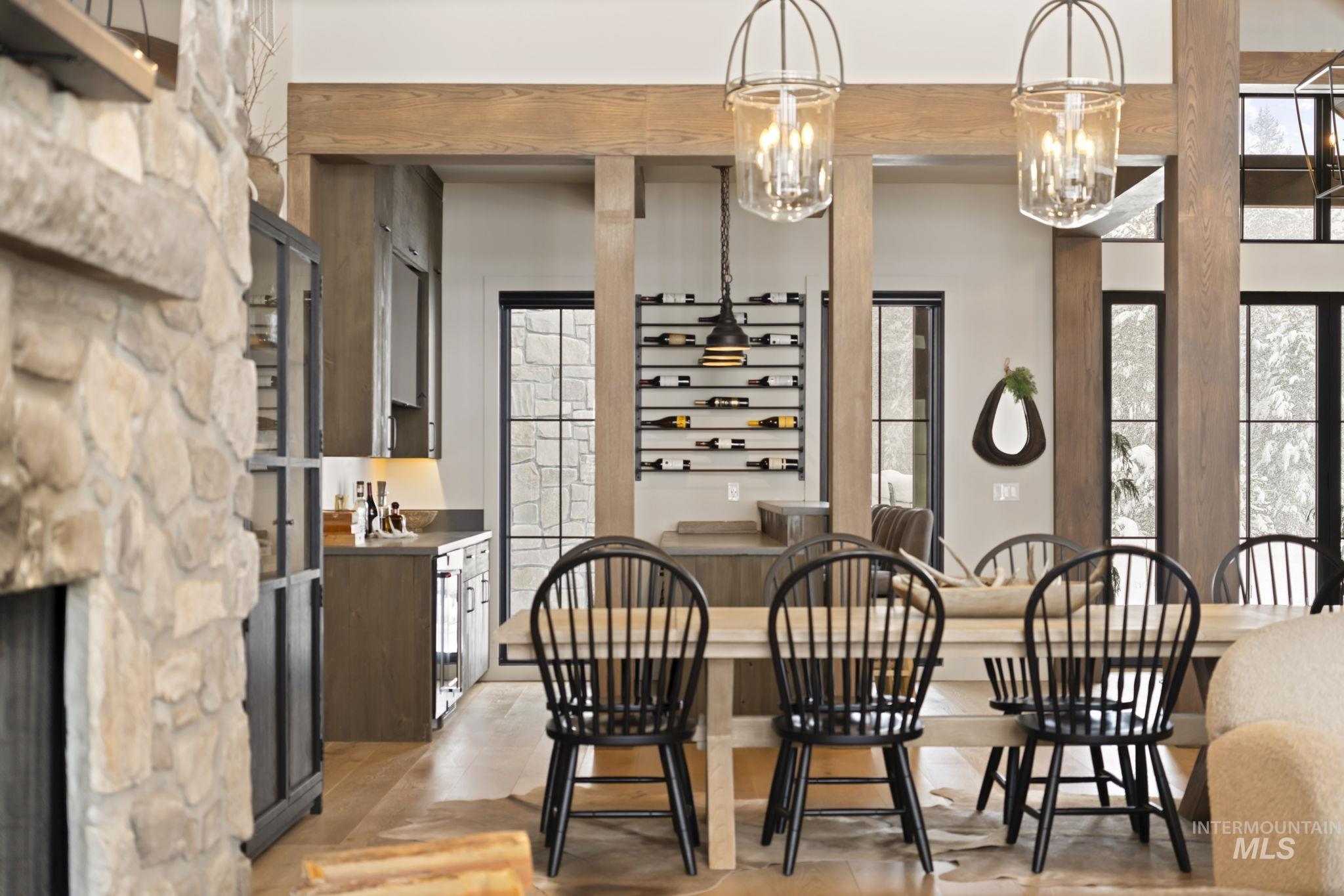 Dining room with a fireplace and beam ceiling