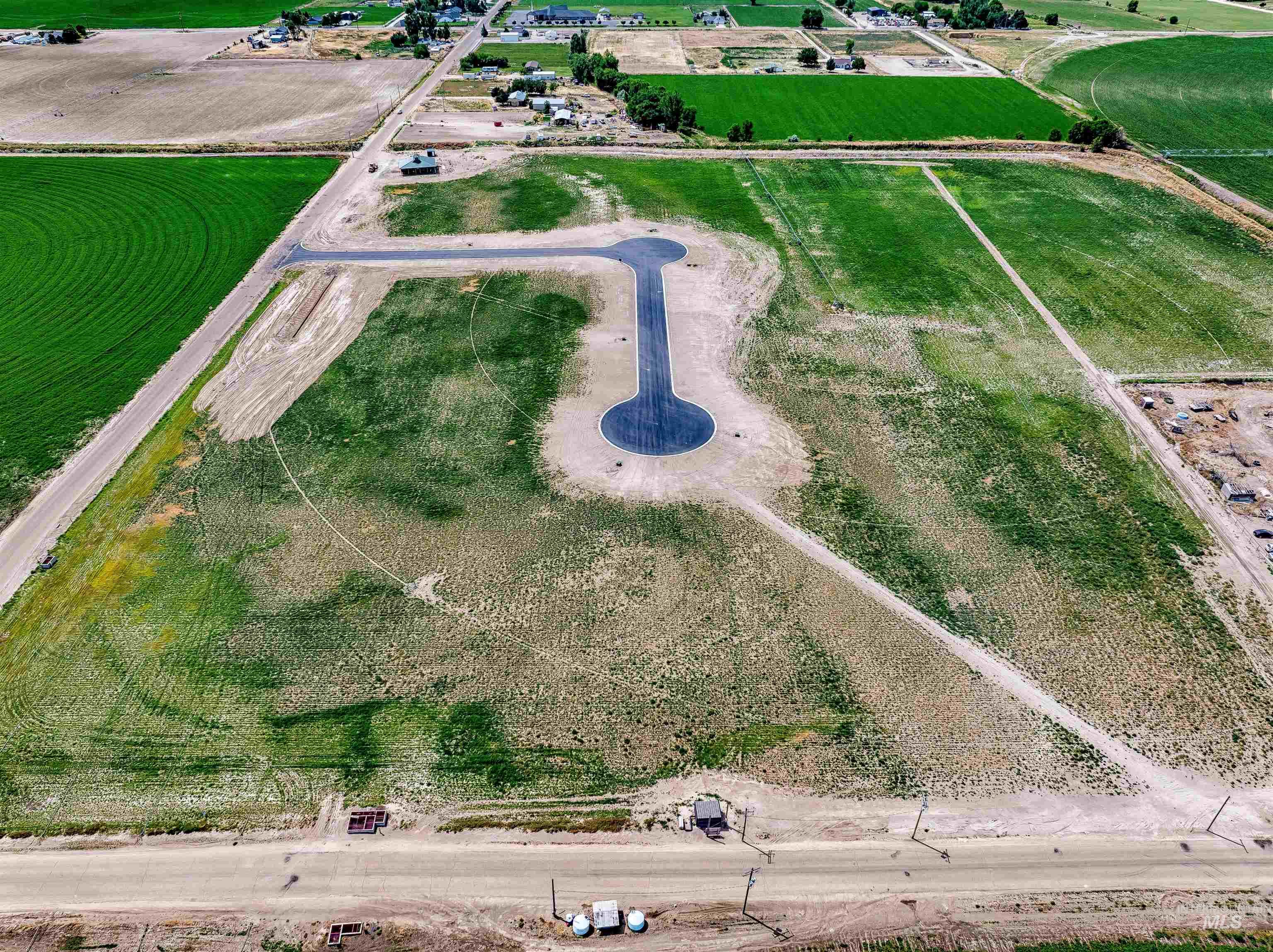Aerial view of property and surrounding area with rural landscape