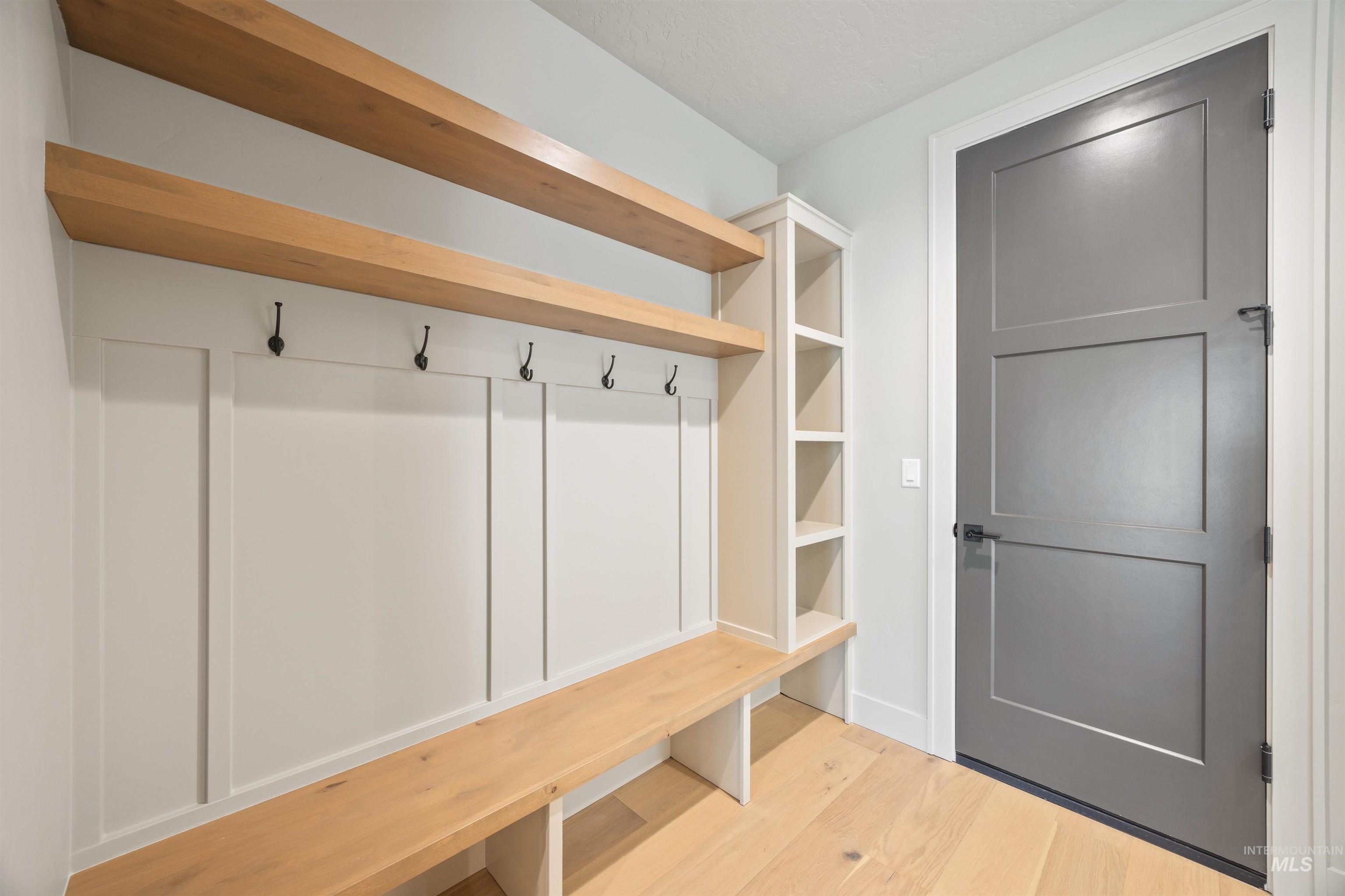 Mudroom with wood finished floors