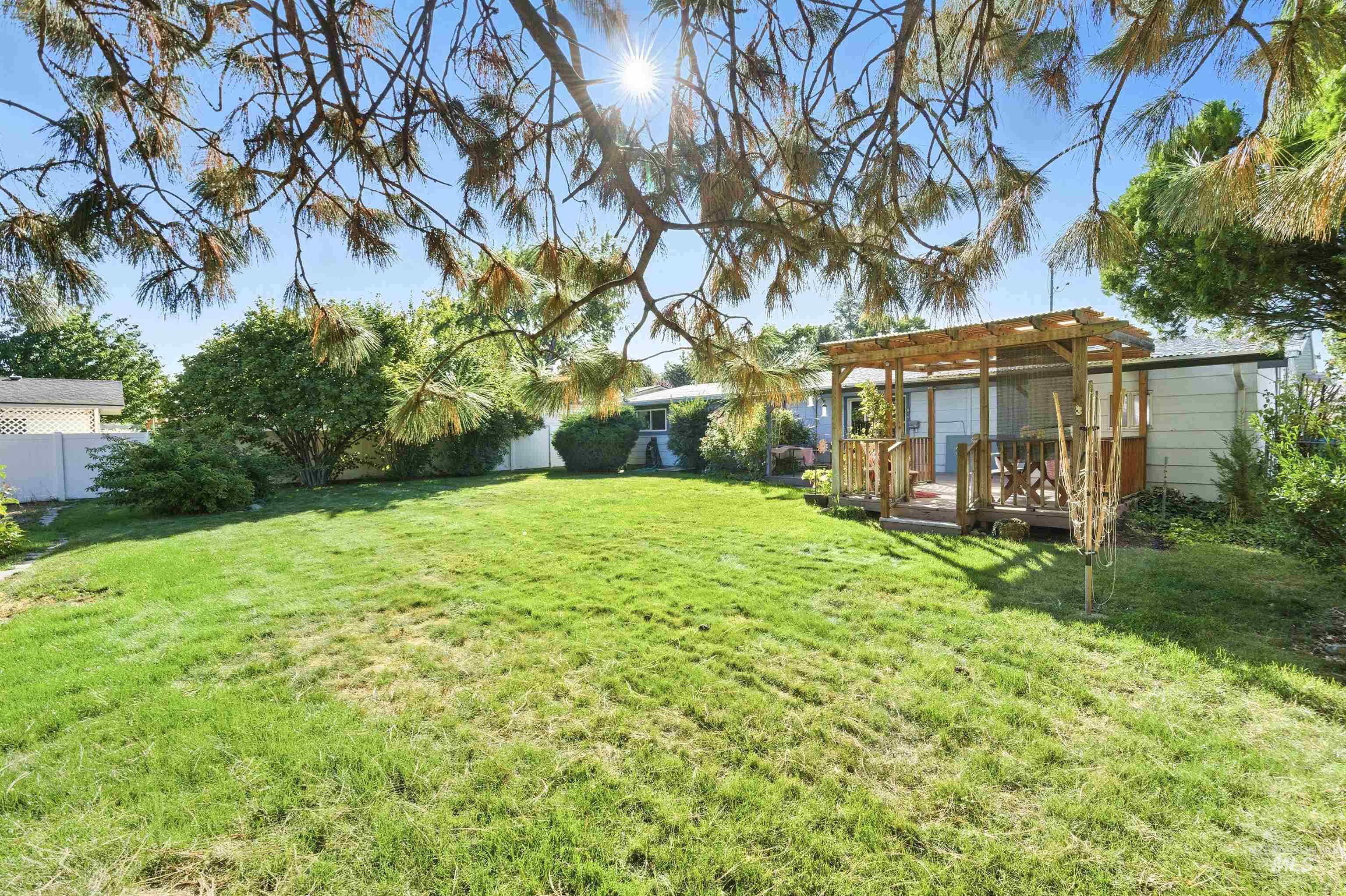 View of yard featuring a wooden deck