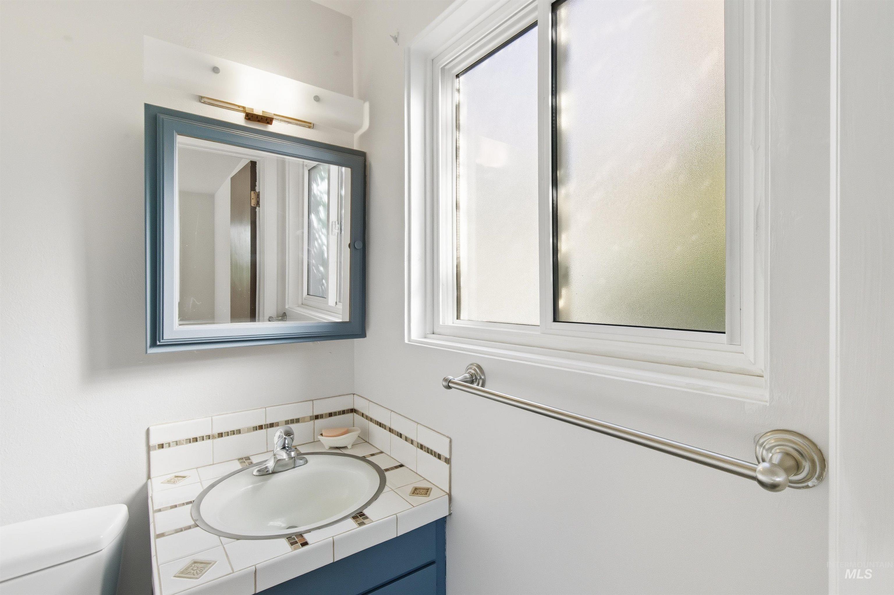 Bathroom with vanity and toilet