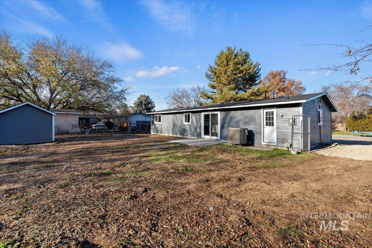 Rear view of house with a patio area