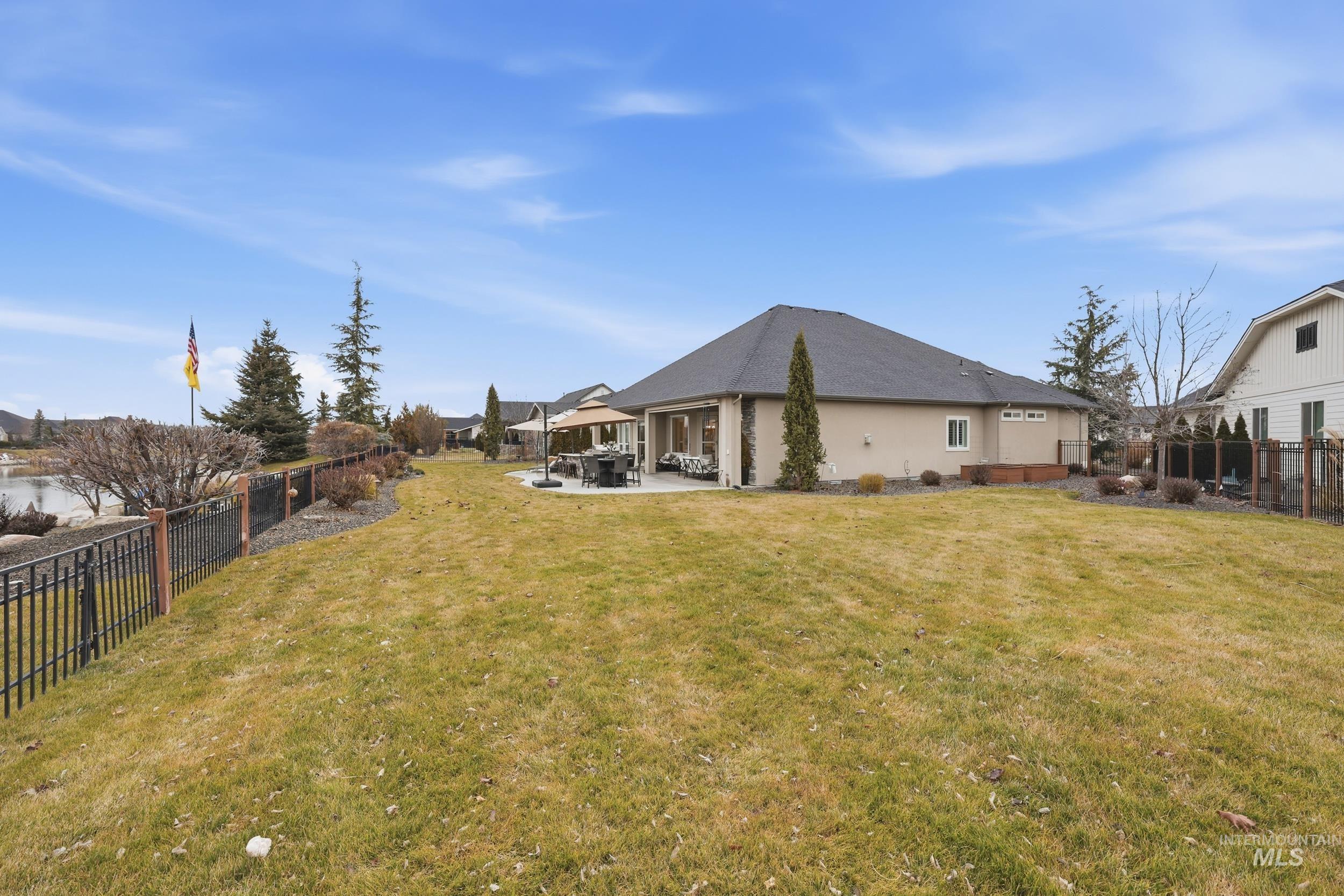 Fenced backyard with a patio area