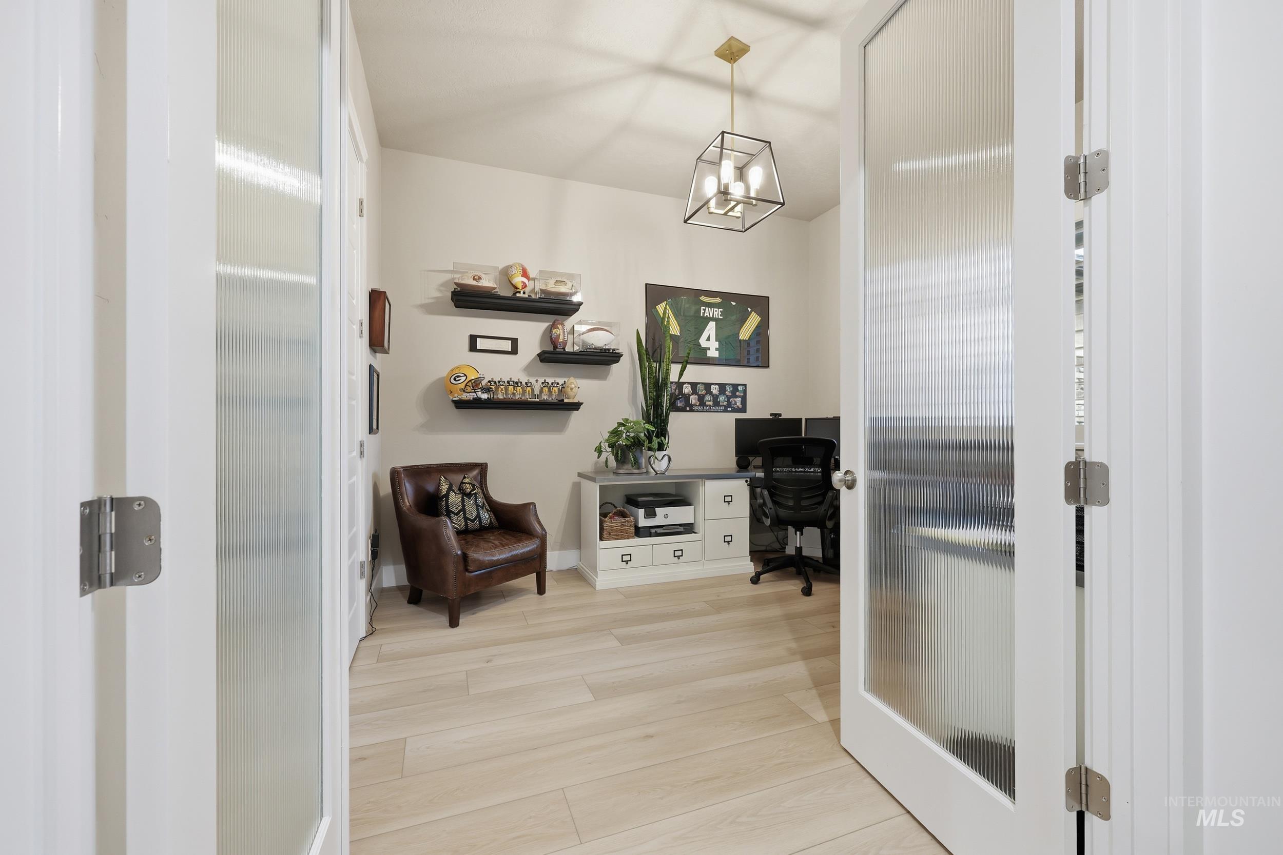 Office featuring light wood finished floors and french doors