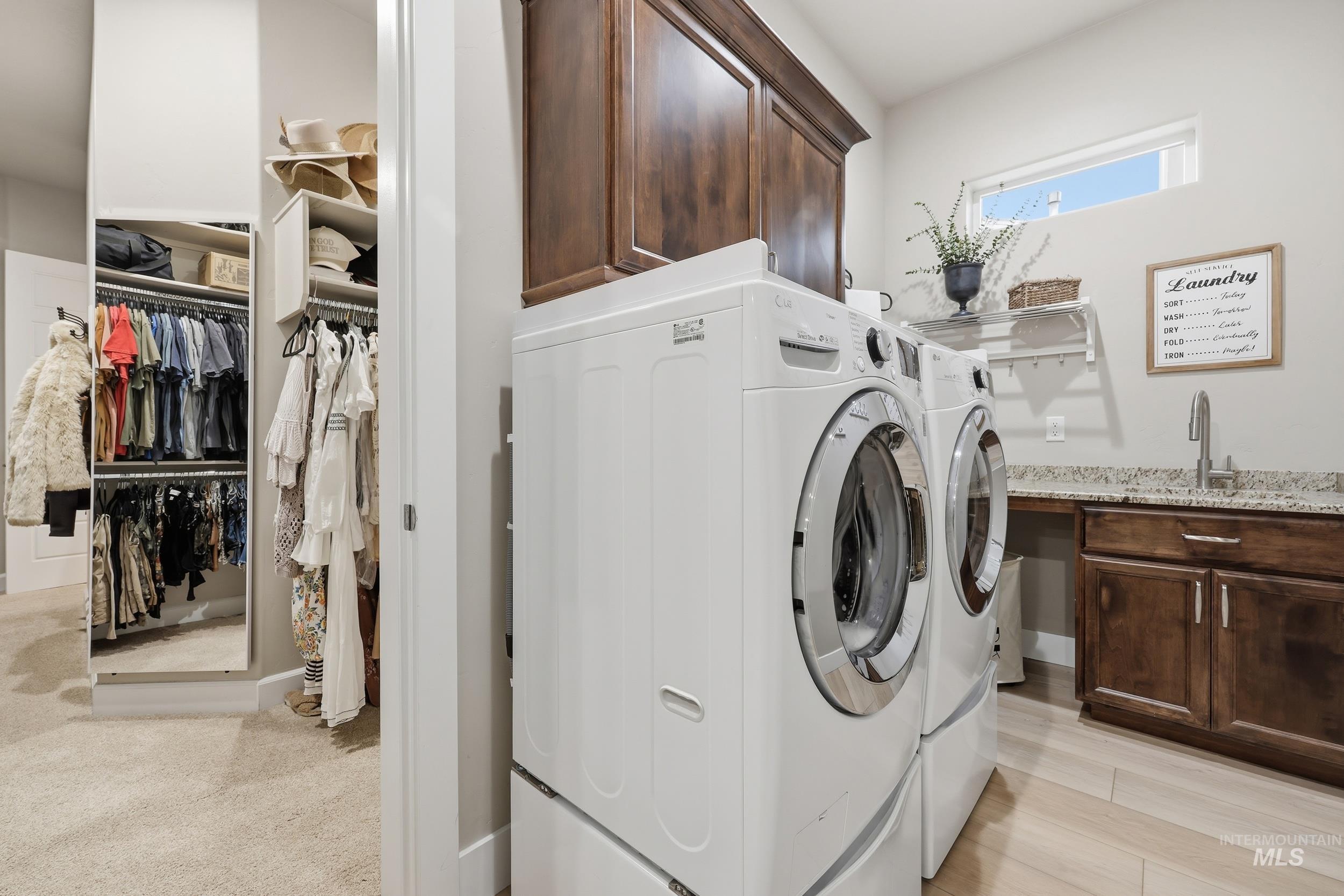 Laundry room featuring washer and dryer and cabinet space