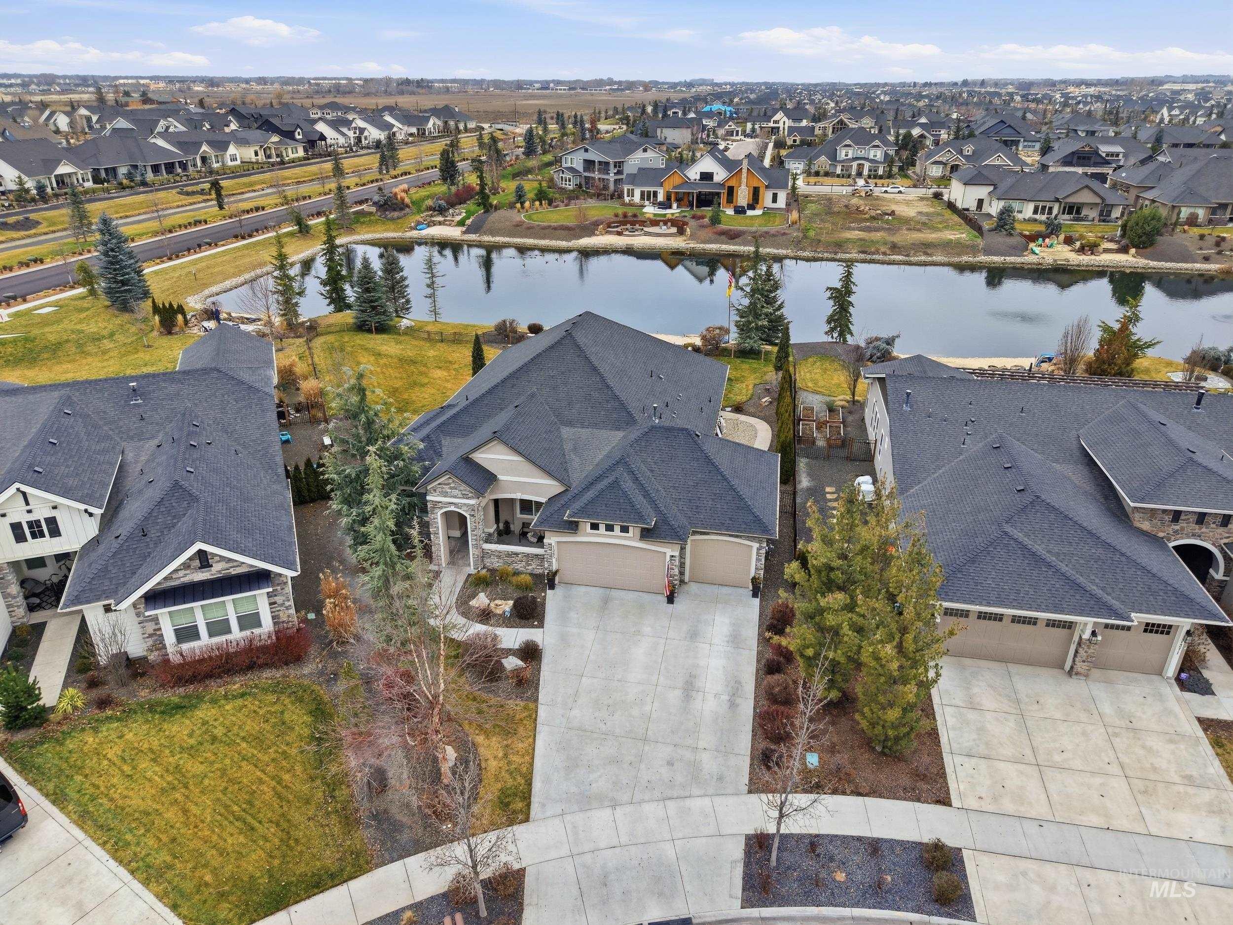 Aerial perspective of suburban area with a nearby body of water