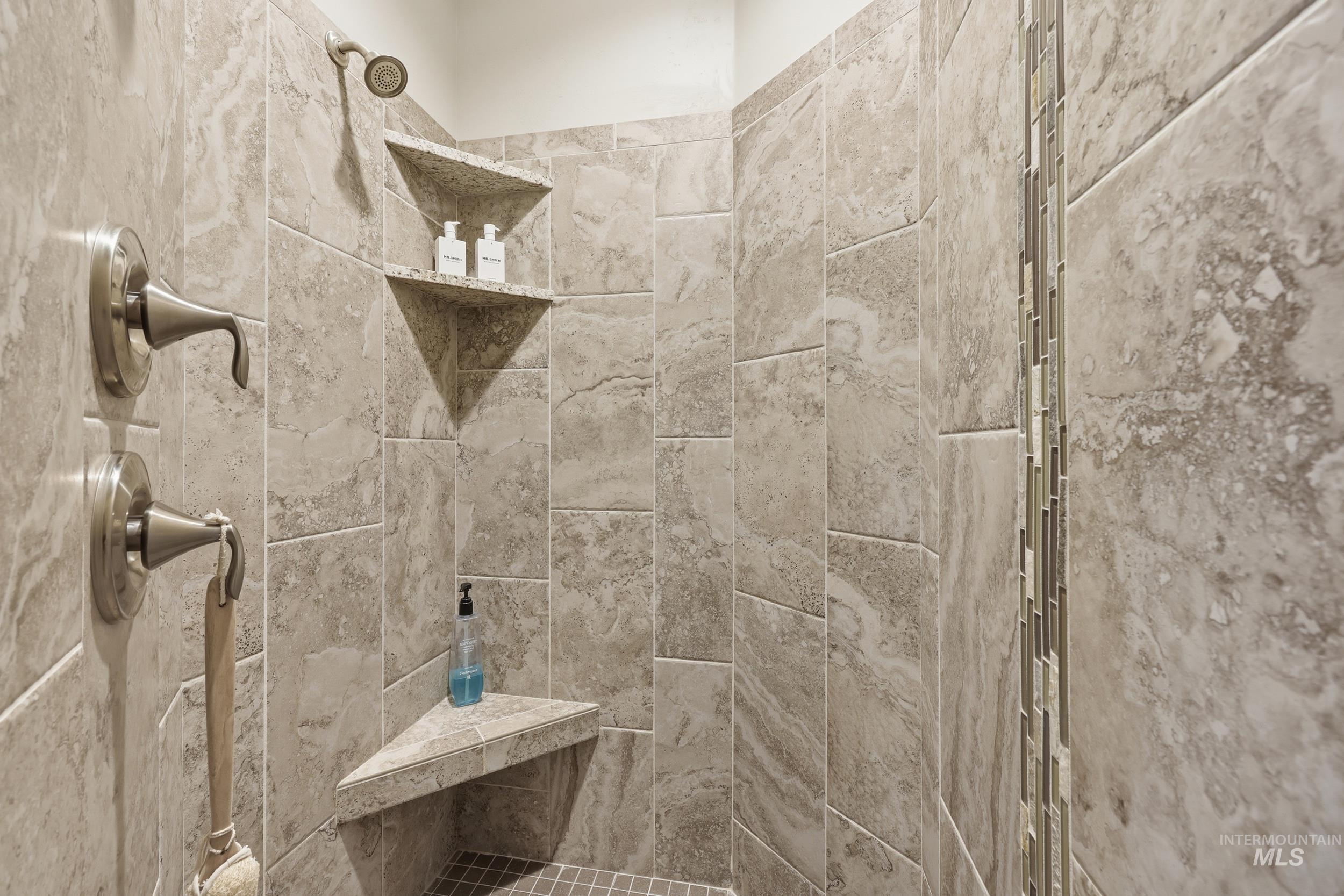 Full bathroom with a tile shower