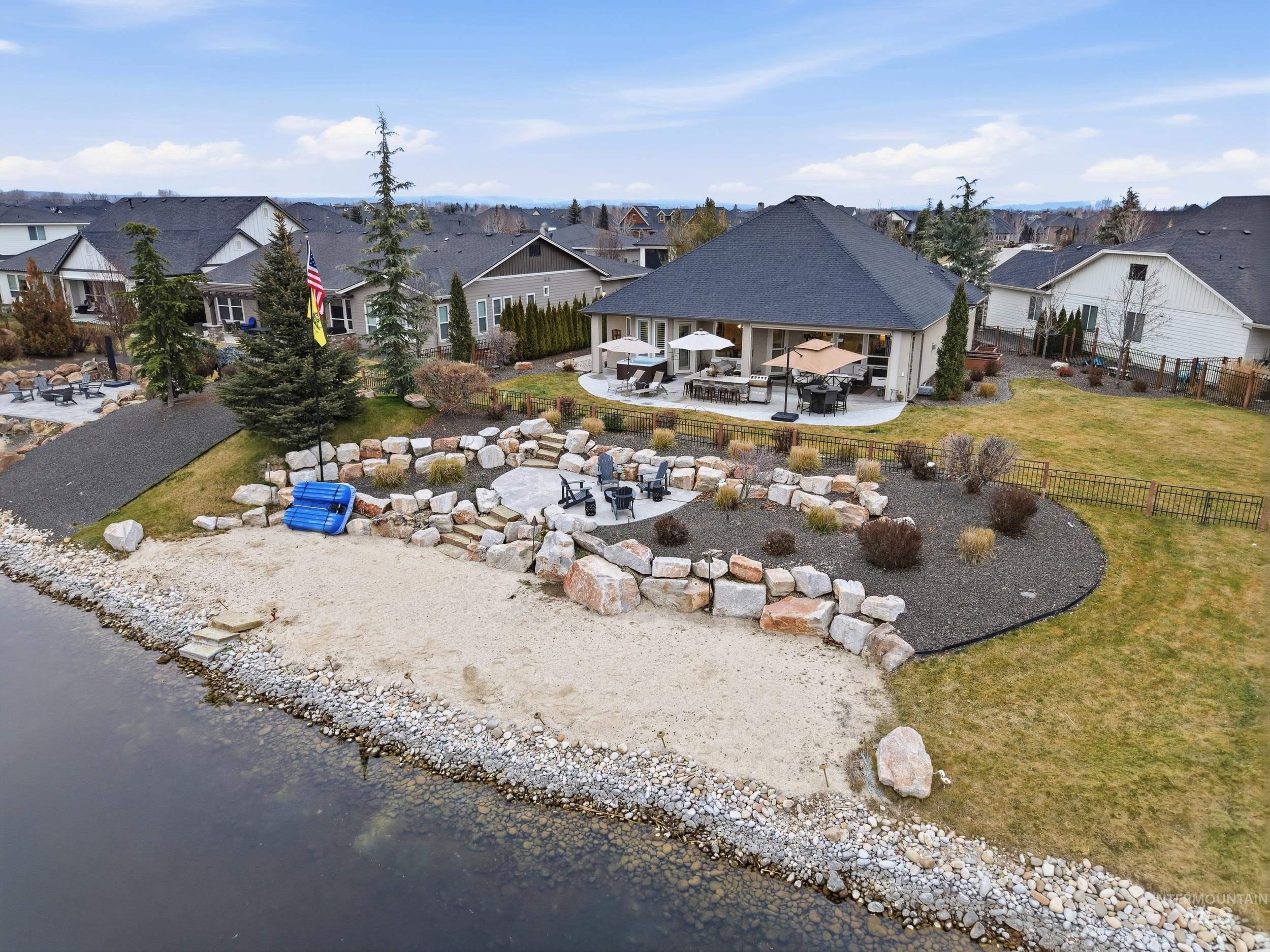 Aerial view of residential area featuring a large body of water