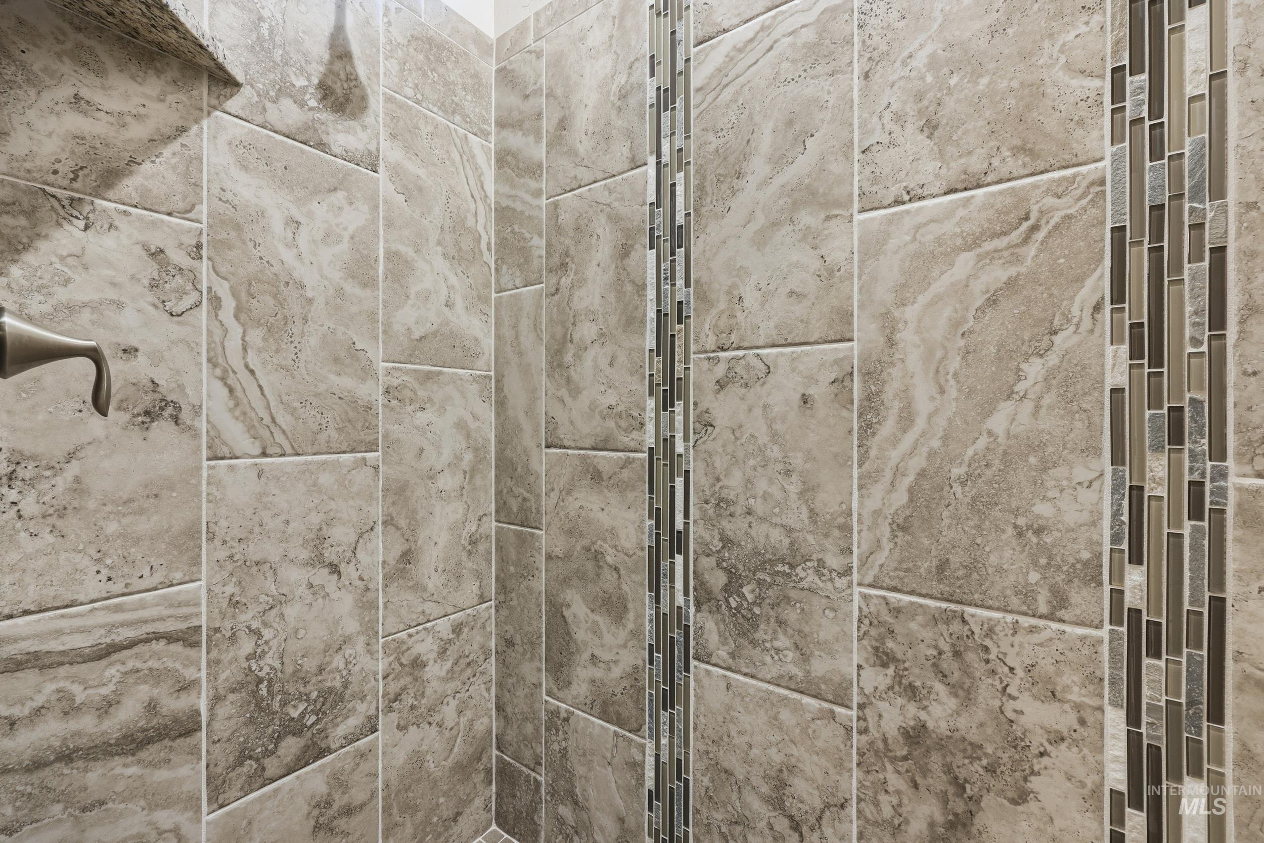 Bathroom view of a tile shower